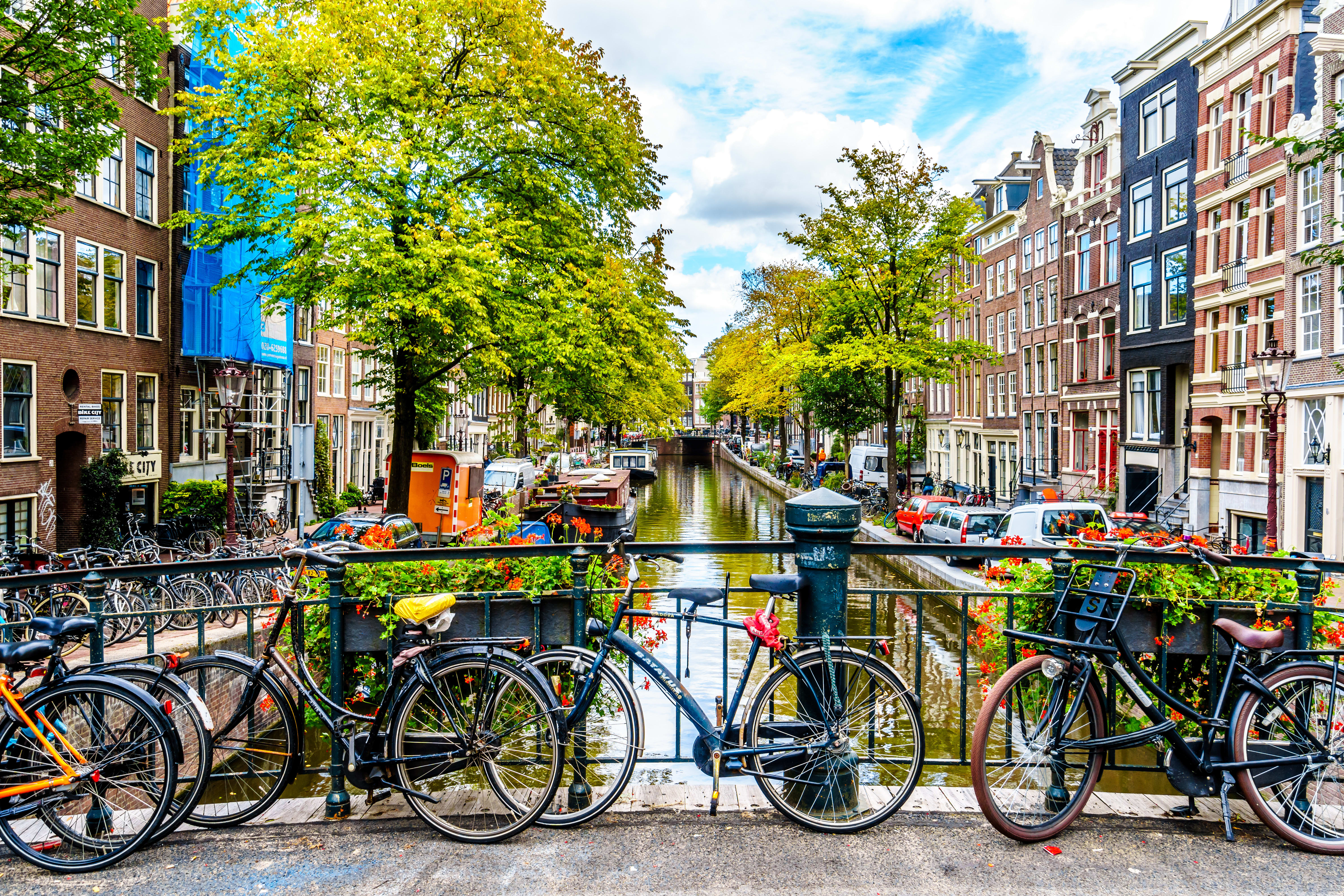 Image of Neighborhood, Bicycle, Vehicle, City, Car, Canal, Outdoors, Water, Boat, Urban, 