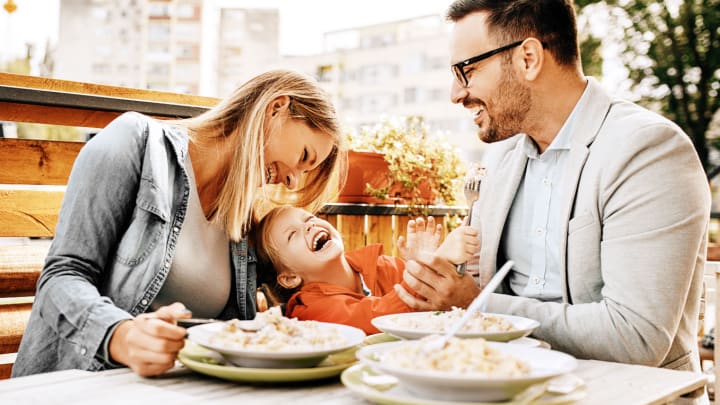 Image of Adult, Male, Man, Person, Head, Female, Woman, Face, People, Baby, Happy, Dining Table, Cutlery, Fork, 