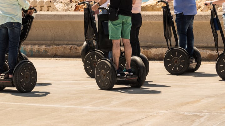 Image of Adult, Male, Man, Person, Vehicle, Segway, Handbag, 