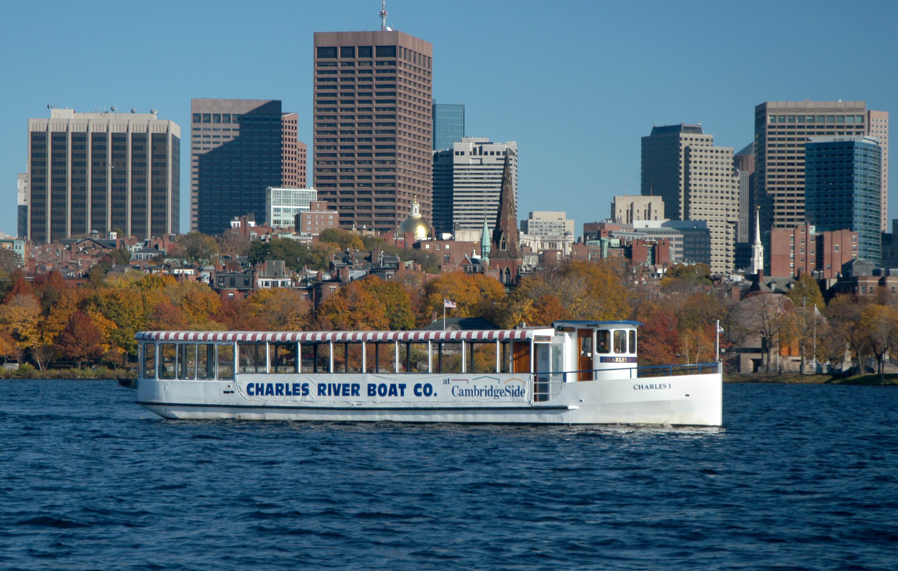 Image of City, Metropolis, Urban, Boat, Ferry, Vehicle, Water, Waterfront, Cityscape, Office Building, Boating, Water Sports, Barge, Watercraft, 