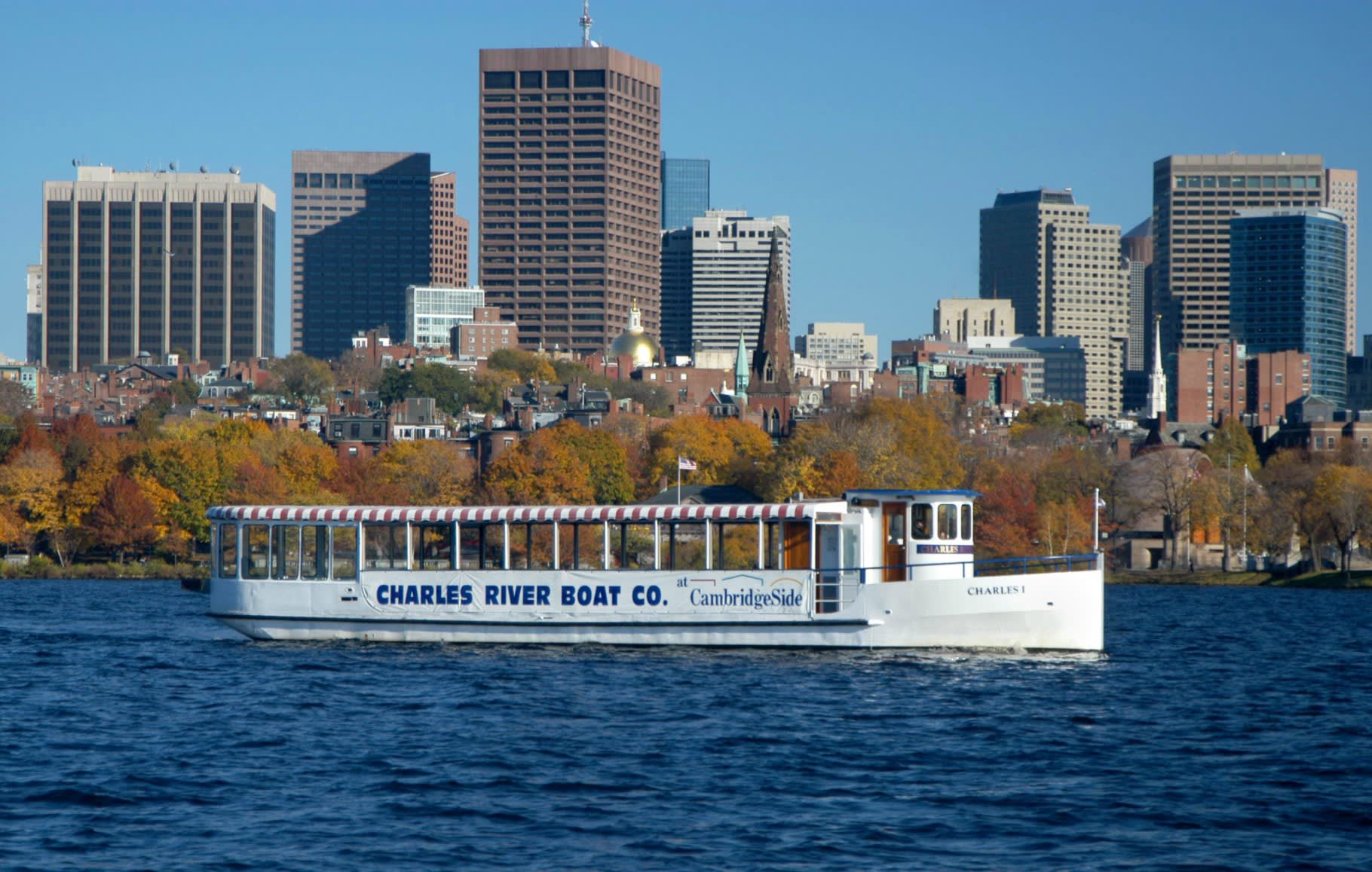 Image of City, Metropolis, Urban, Boat, Ferry, Vehicle, Water, Waterfront, Cityscape, Boating, Water Sports, Office Building, 