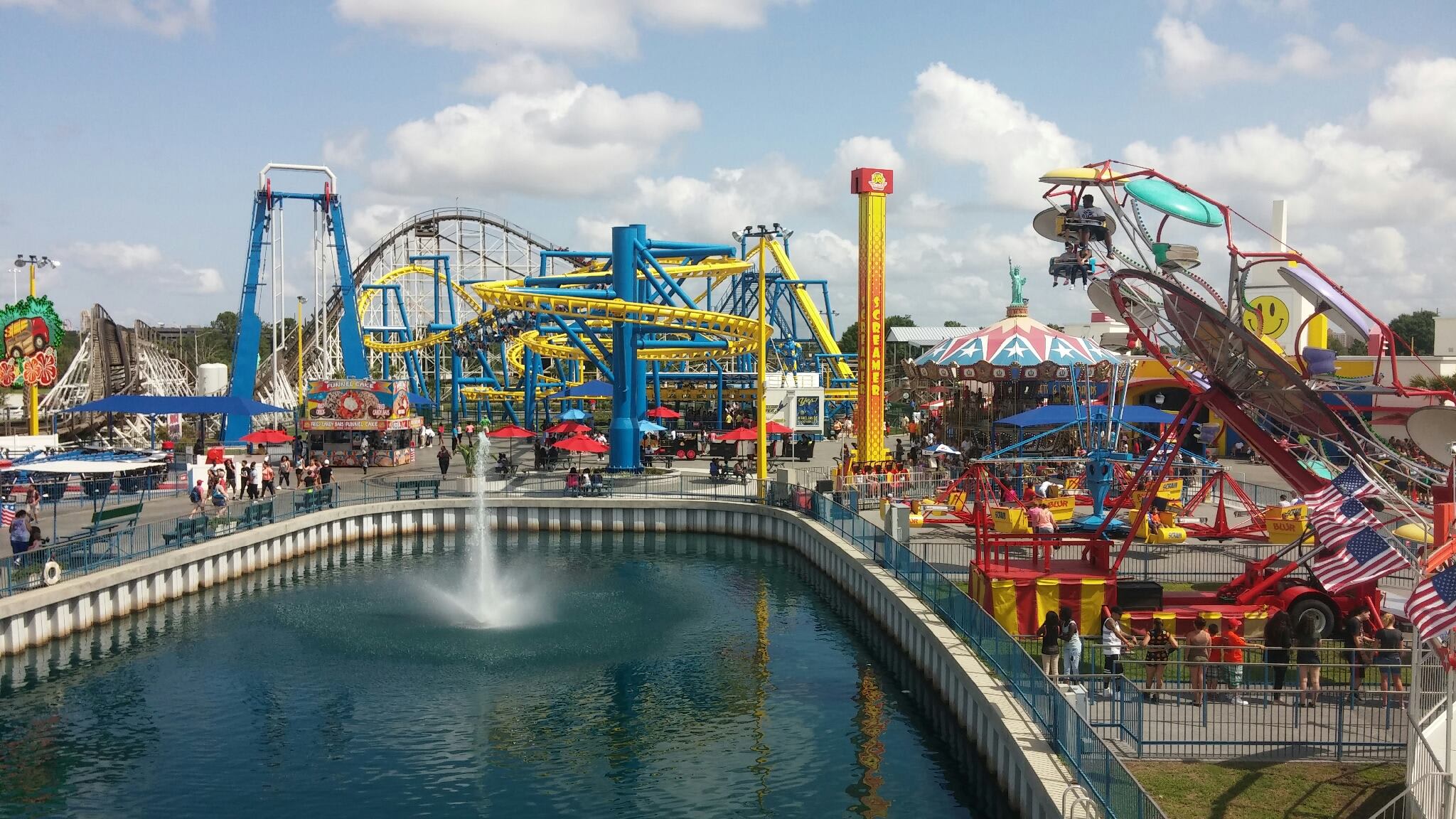 Image of Amusement Park, Fun, Theme Park, Person, Bench, Water, Flag, 