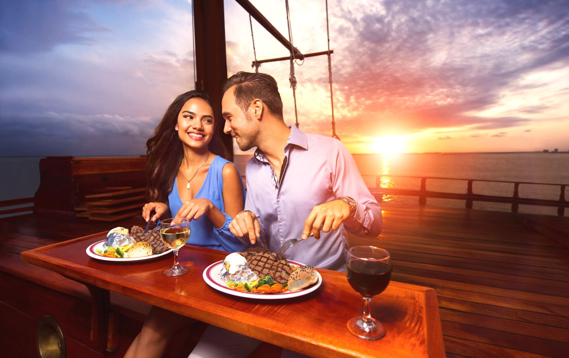 Image of Food, Lunch, Meal, Dining Table, Furniture, Table, Dining Room, Indoors, Dating, Person, Romantic, Plate, Dish, Nature, Outdoors, Sky, Bread, Adult, Male, Man, Face, Head, Photography, Portrait, Female, Woman, Cutlery, Fork, Necklace, 