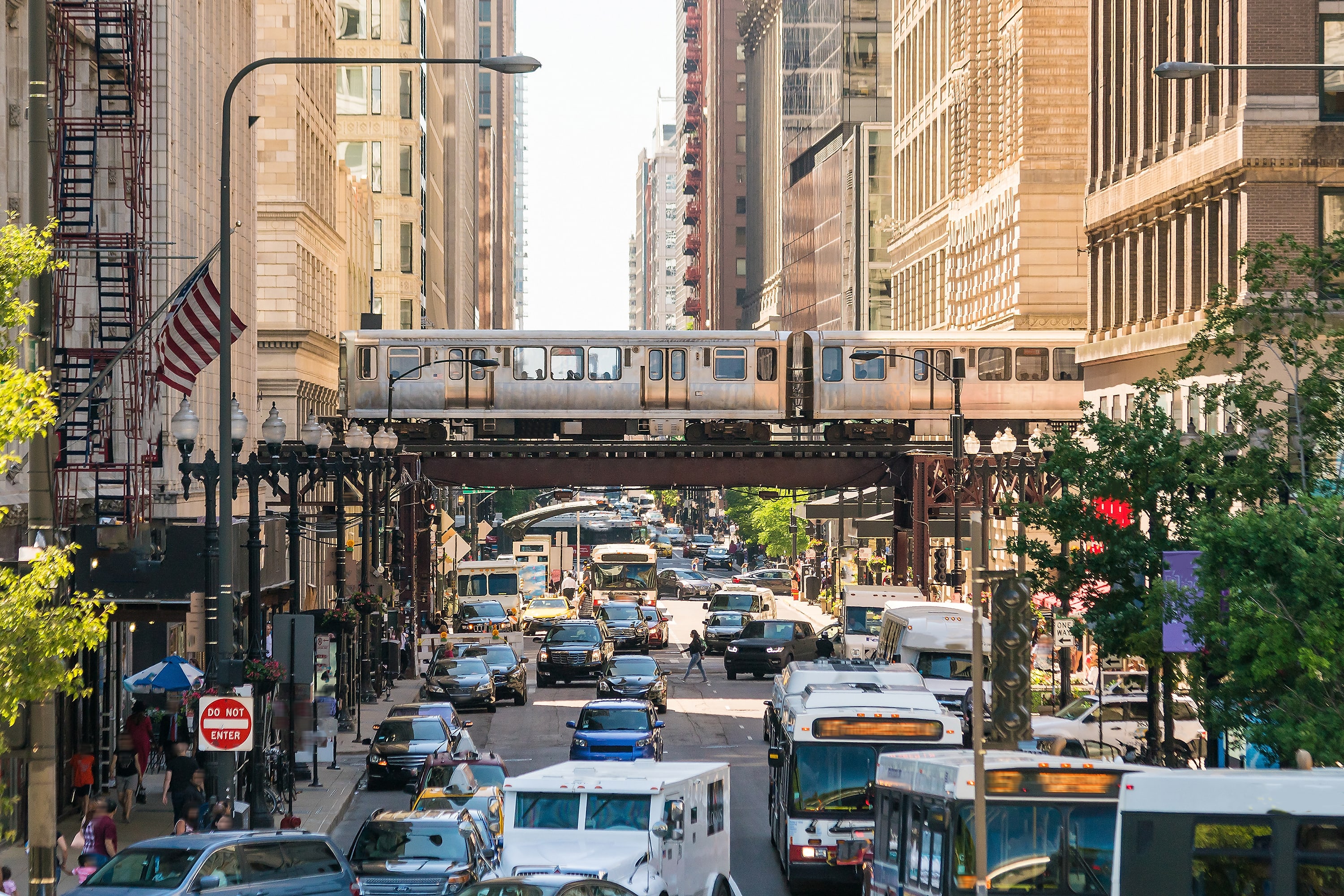 Image of City, Metropolis, Urban, Road, Cityscape, Street, Neighborhood, Person, Car, Vehicle, Bus, Truck, Railway, Train, Handbag, Road Sign, Sign, 