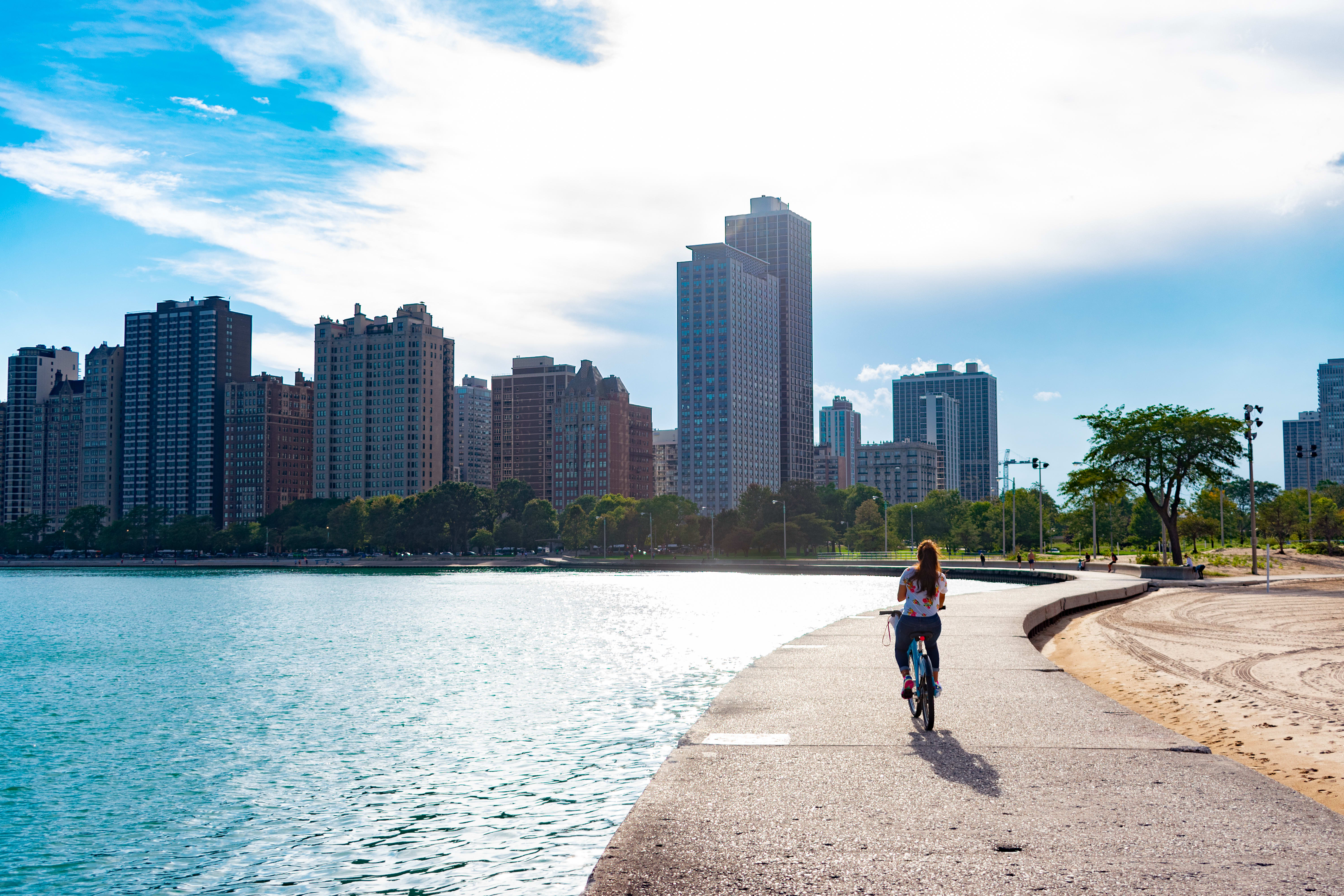 Image of City, Urban, Cityscape, Nature, Outdoors, Scenery, Person, Summer, Water, Waterfront, Bicycle, High Rise,