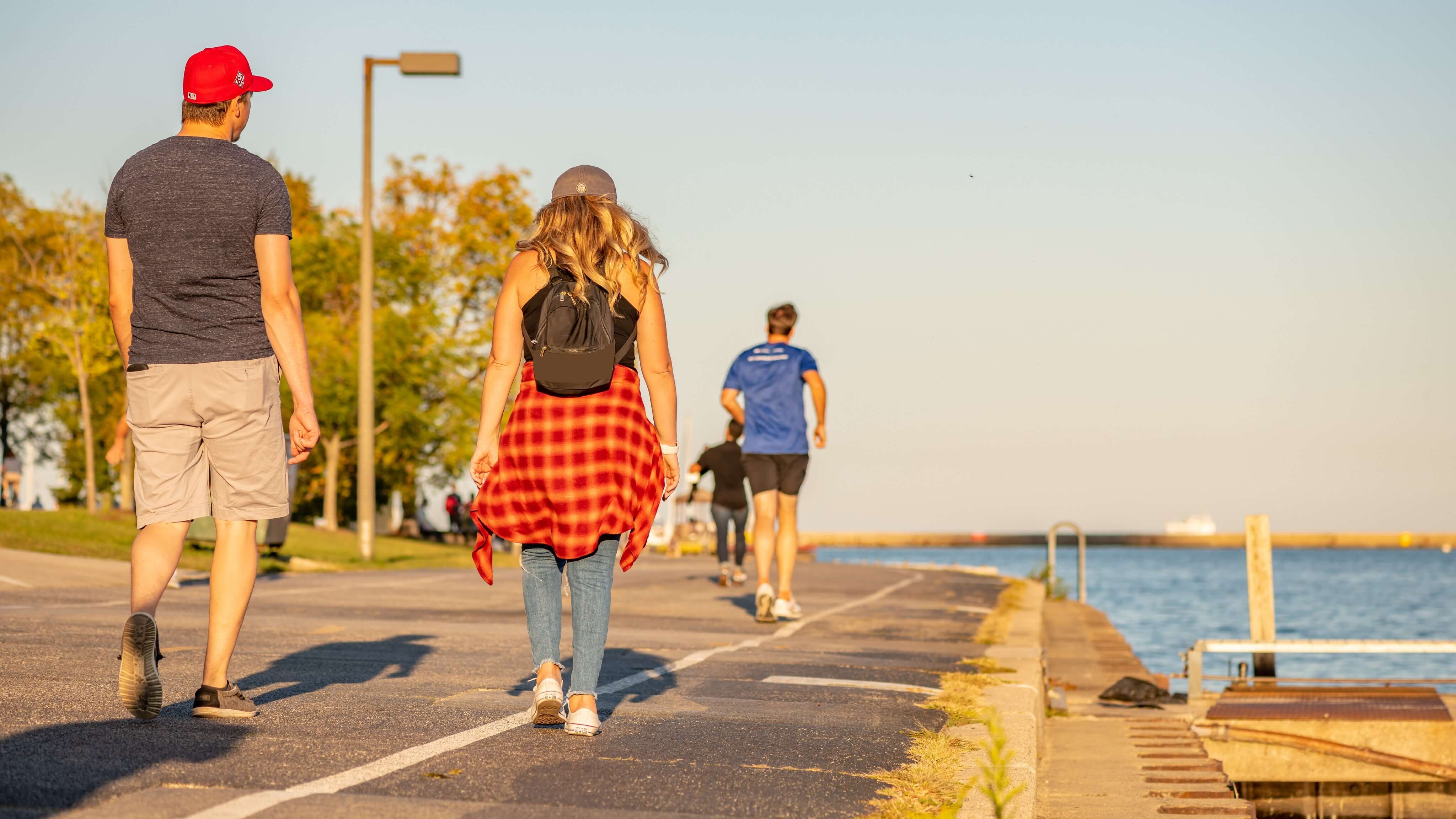 Image of Person, Walking, Female, Girl, Teen, Adult, Male, Man, Shorts, Shoe, 