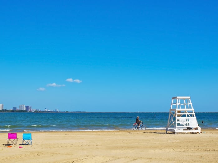 Image of Summer, Beach, Coast, Nature, Outdoors, Sea, Shoreline, Water, Chair, Furniture, Sky, Bicycle, Vehicle, Horizon, Person, Waterfront, 