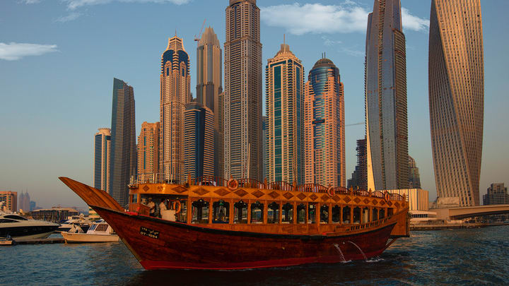 Image of City, Metropolis, Urban, Vehicle, Yacht, Water, Waterfront, High Rise, Cityscape, Watercraft, Boat, Barge, Sailboat, Person, Office Building, Ferry, 