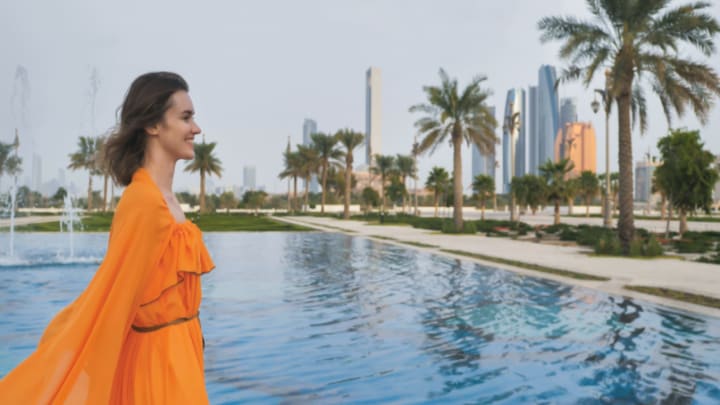 Image of City, Nature, Outdoors, Scenery, Person, Walking, Photography, Adult, Female, Woman, Palm Tree, Tree, Pool, Water, Beachwear,