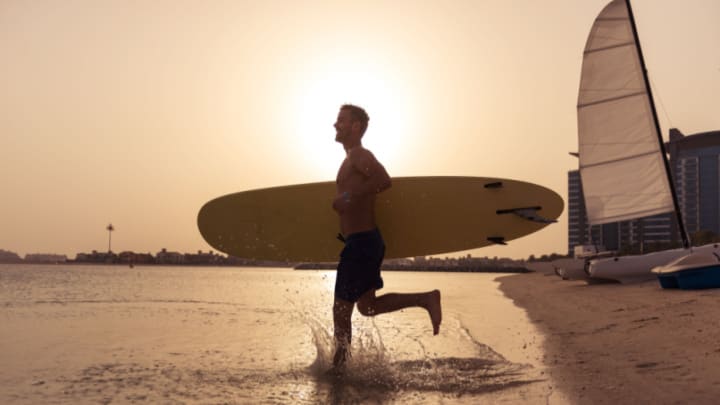 Image of Nature, Outdoors, Sea, Water, Adult, Male, Man, Person, Shorts, Boat, Vehicle, Sea Waves, 