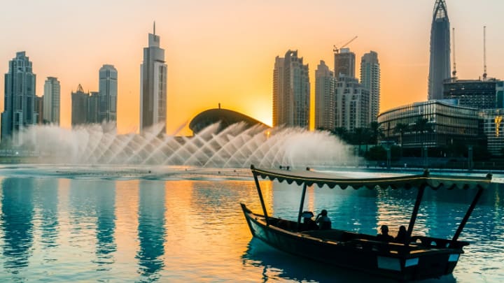 Image of City, Metropolis, Urban, Cityscape, Boat, Vehicle, Water, Waterfront, Person, High Rise, Nature, Outdoors, Scenery, Fountain,
