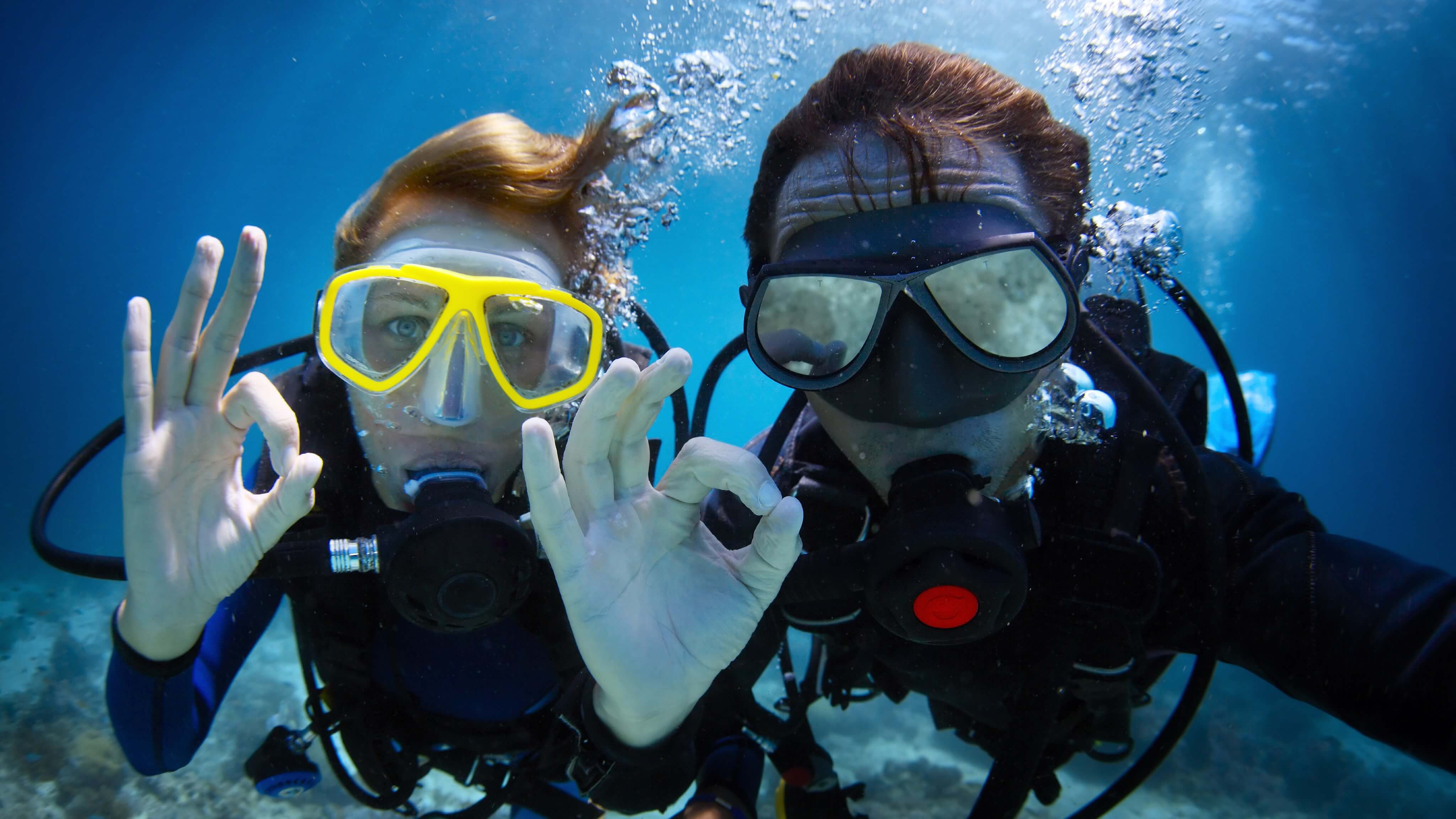 Image of Nature, Outdoors, Water, Adventure, Person, Scuba Diving, Swimming, Water Sports, Adult, Female, Woman, Male, Man, Glasses, Glove, 