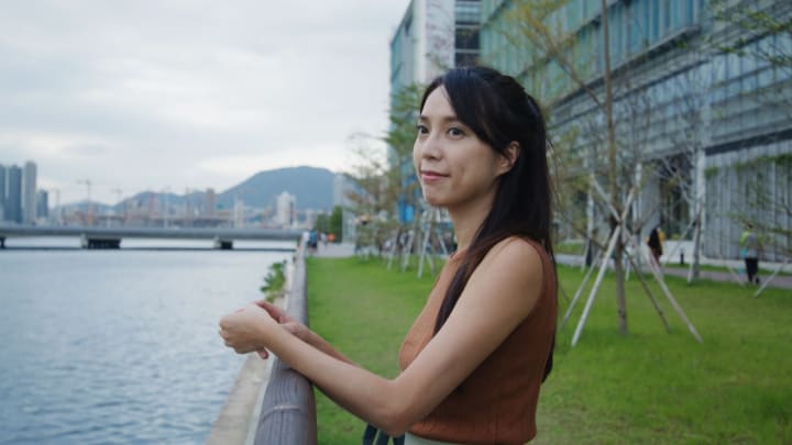 Image of Face, Head, Person, Photography, Portrait, Grass, City, Water, Waterfront, Female, Girl, Teen, Urban, Smile, Office Building, Nature, Outdoors, Scenery, 