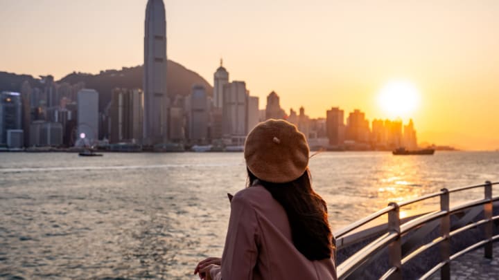 Image of Nature, Outdoors, Sky, City, Scenery, Cityscape, Urban, Water, Waterfront, Photography, Adult, Female, Person, Woman, Landscape, Sunrise, Boat, Hat, 