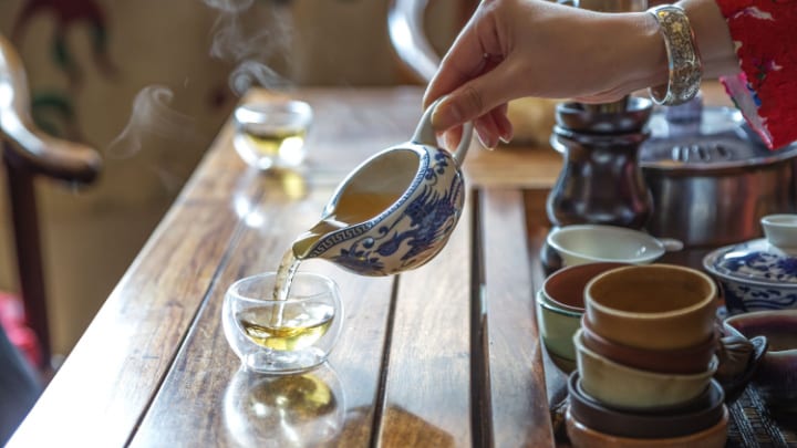 Image of Cup, Cooking, Food, Pouring Food, Dining Table, Furniture, Table, Baby, Person, Saucer, Pottery, 