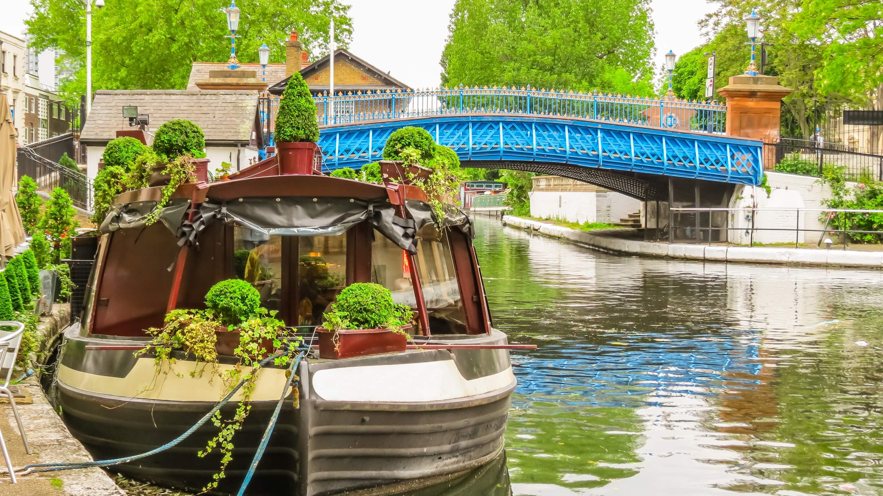 Image of Canal, Outdoors, Water, Plant, Nature, Scenery, Path, Arch, Chair, Boat, Vehicle, Watercraft, Boating, Water Sports, 