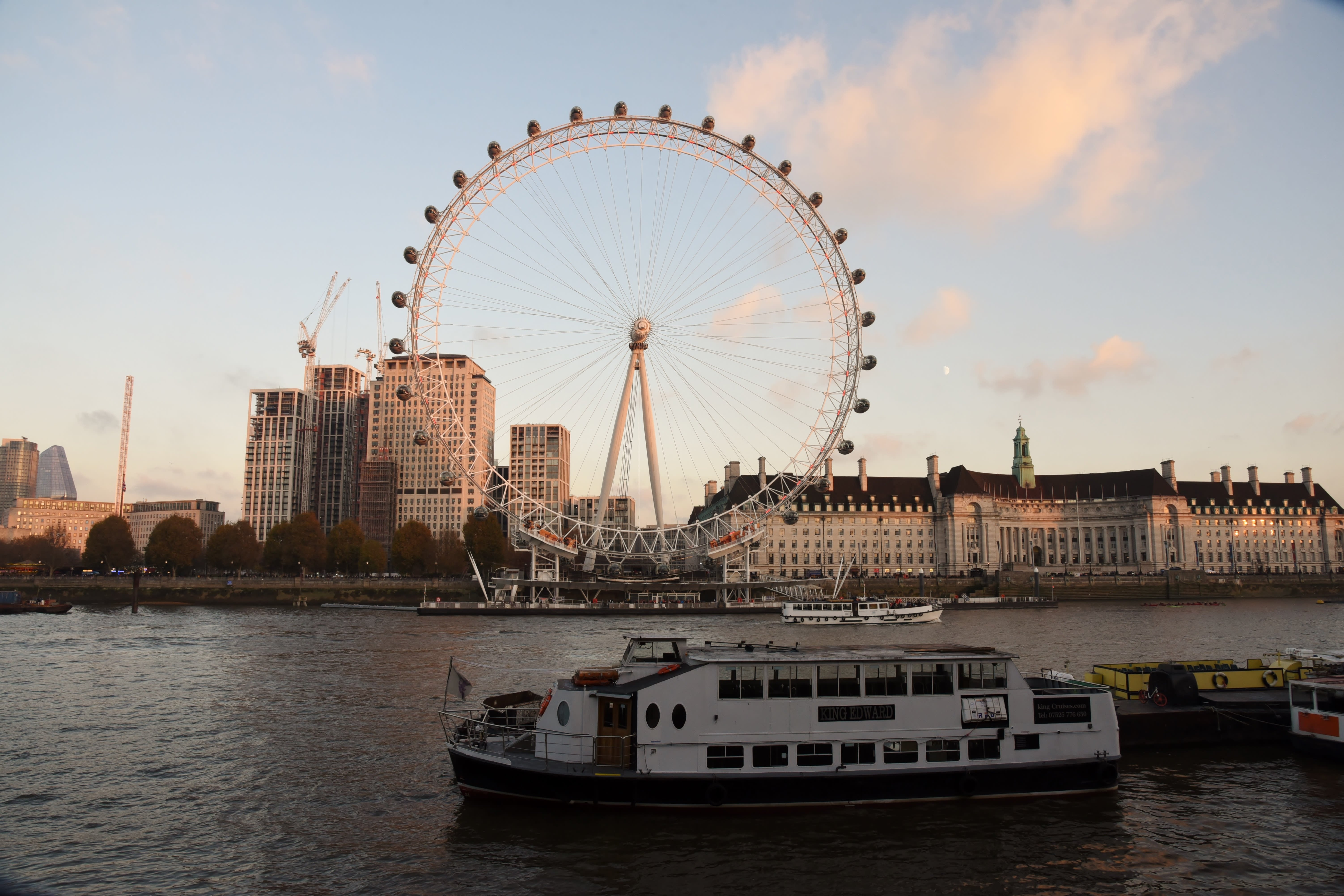 Image of Water, Waterfront, Boat, Vehicle, City, Watercraft, Cityscape, Urban, Person, Ferry, Amusement Park, Ferris Wheel, Fun, 