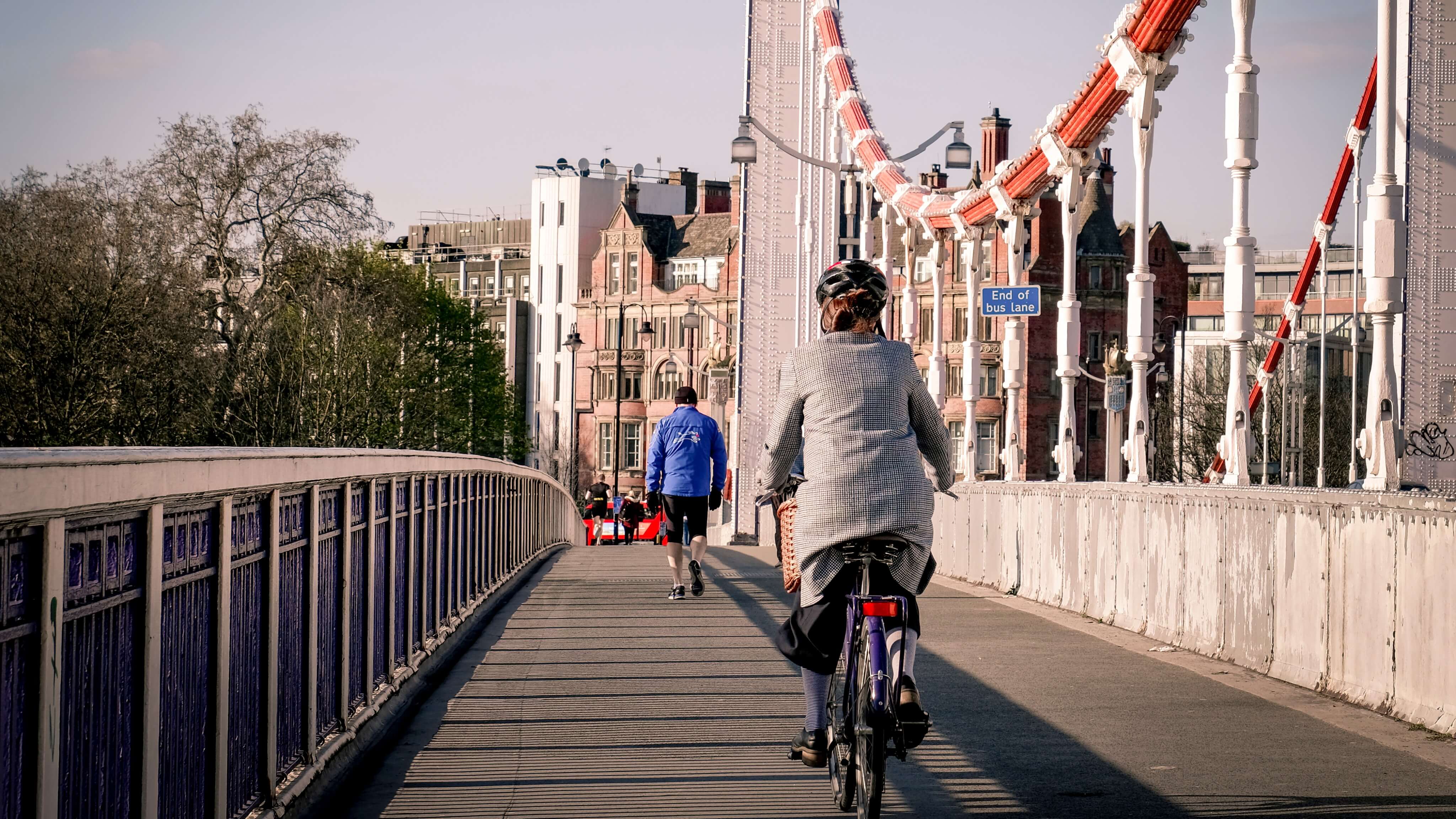 Image of Person, Adult, Male, Man, Helmet, City, Bicycle, Vehicle, Glove, Path, Shoe, Handbag, Cycling, Urban, 