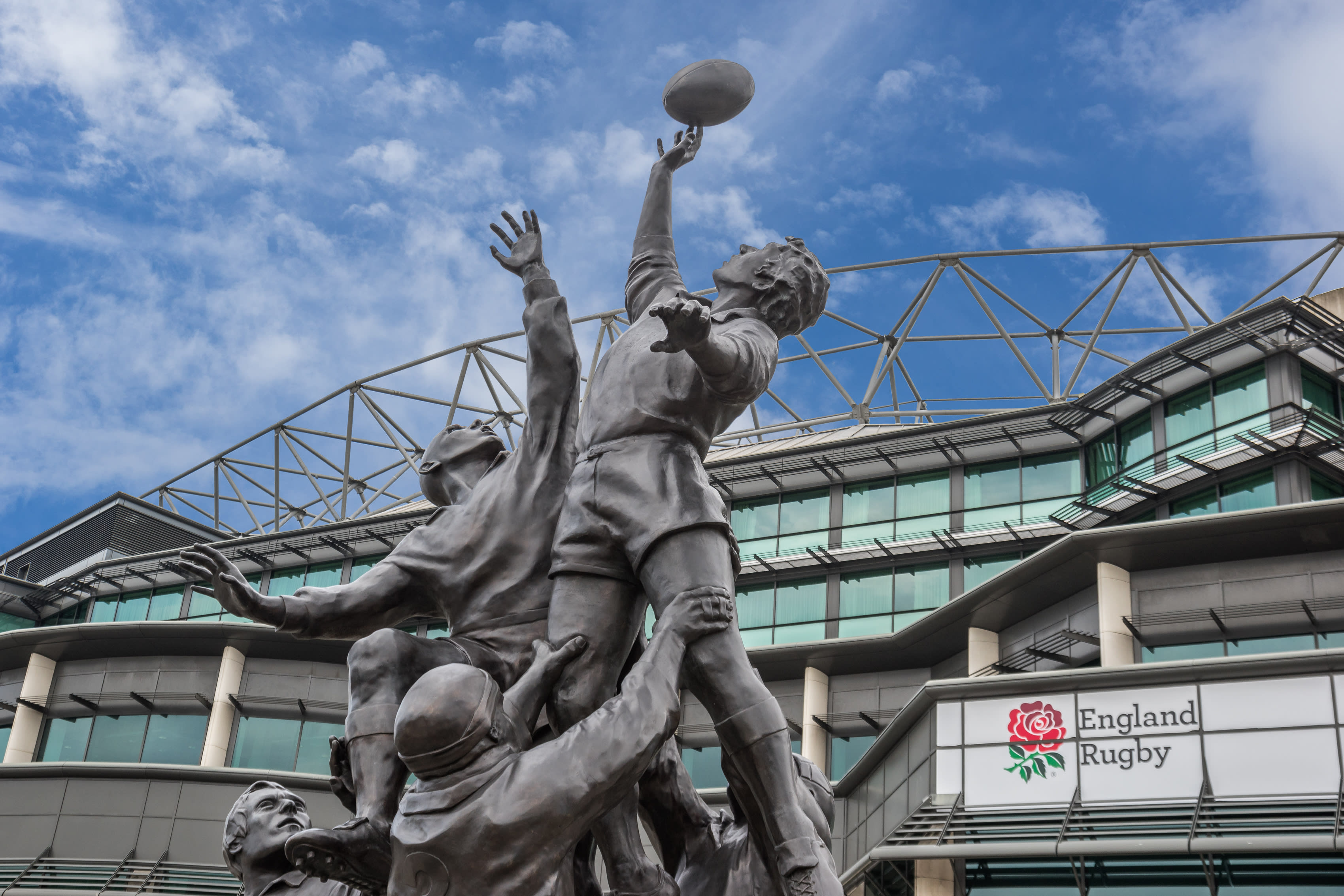 Image of Adult, Male, Man, Person, Rugby Ball, Monument, Art, Handrail, 