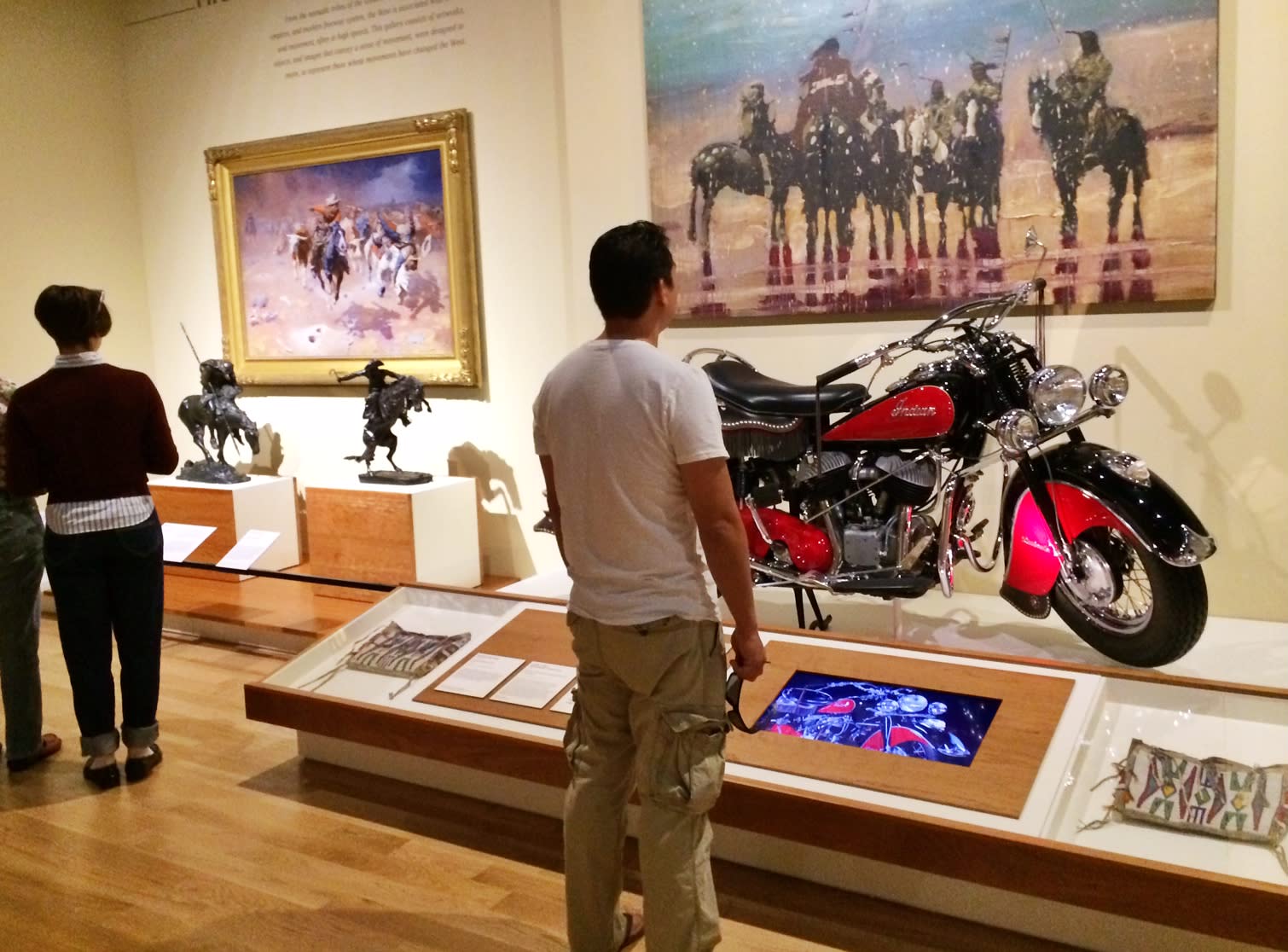 Image of Adult, Male, Man, Person, Machine, Wheel, Indoors, Museum, Motorcycle, Vehicle, Art, Shoe, 