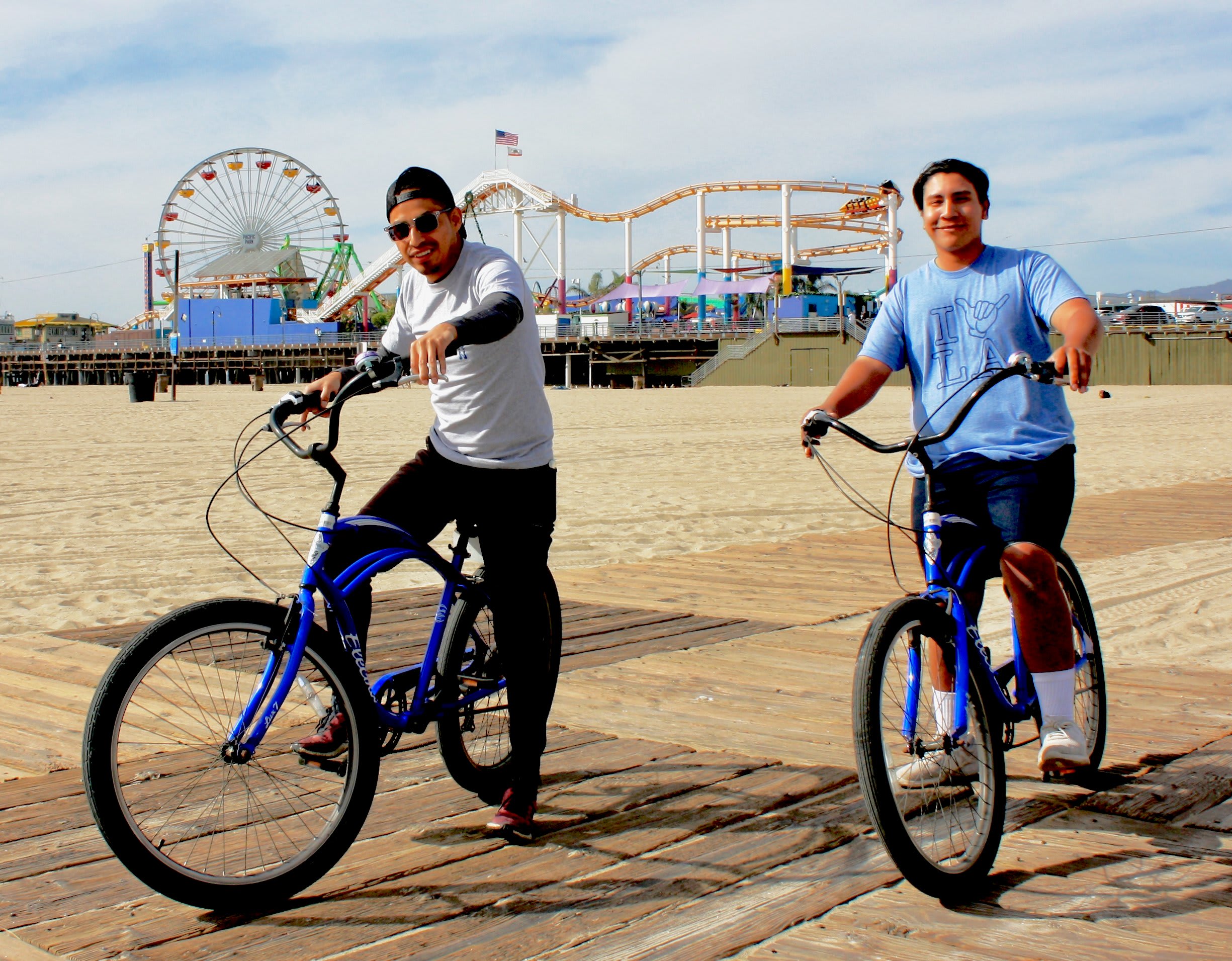 Image of Boy, Male, Person, Teen, Adult, Man, Bicycle, Vehicle, Photography, Wheel, Water, Waterfront, Face, Portrait, Path, Boardwalk, Bridge, City, 