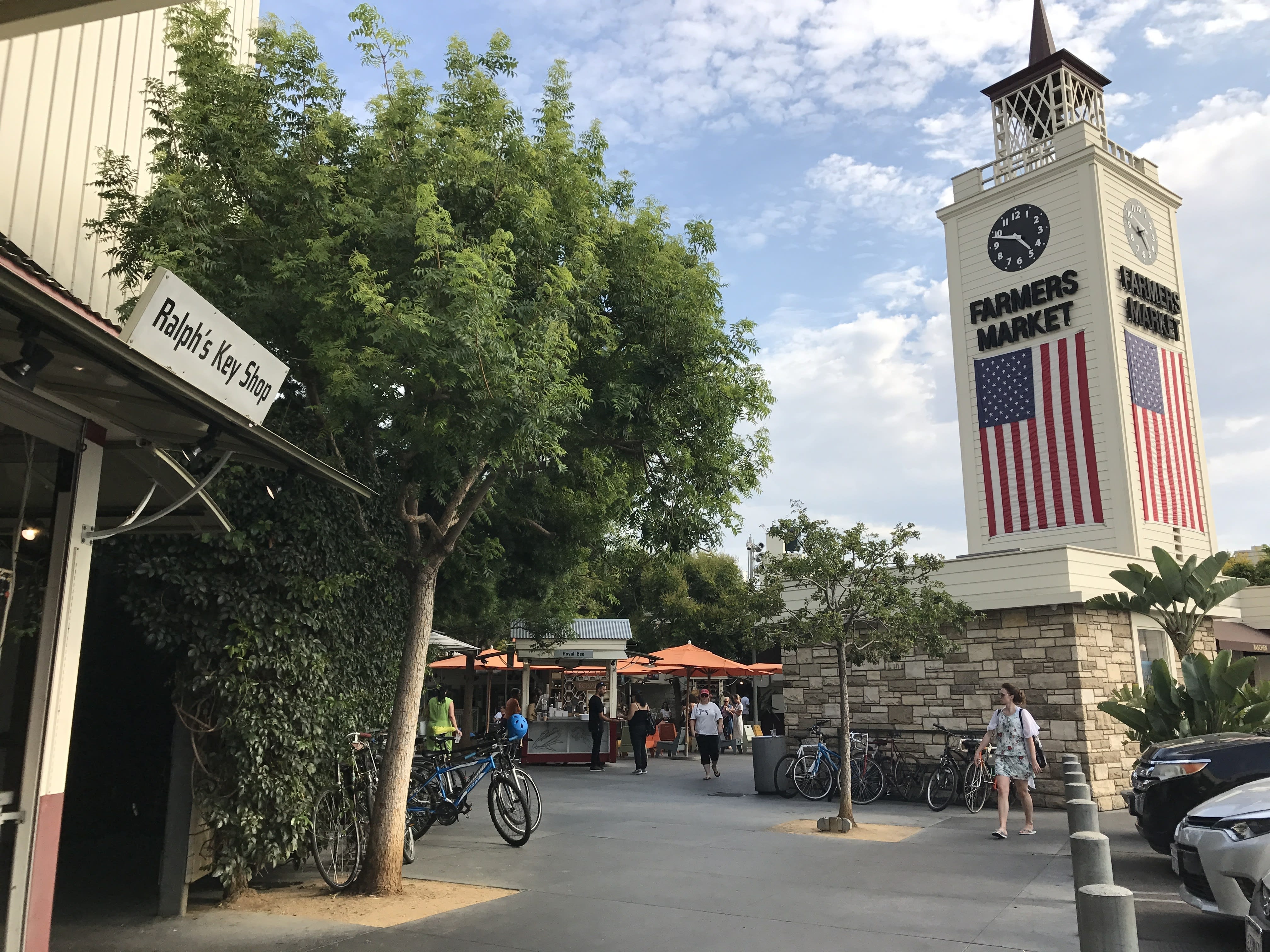 Image of Clock Tower, Tower, City, Outdoors, Shelter, Road, Street, Urban, Person, Car, Vehicle, Bicycle, Handbag,