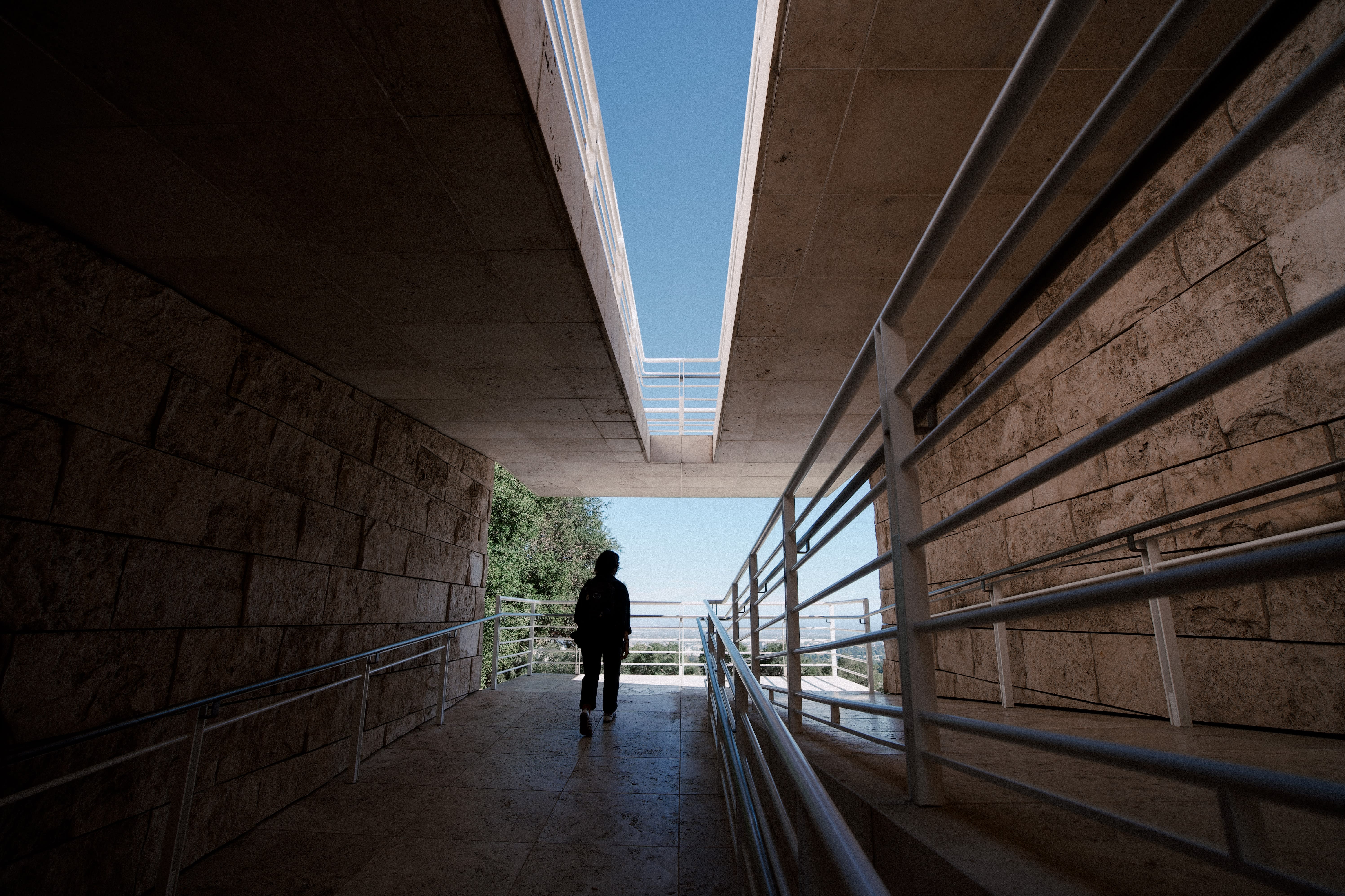 Image of Handrail, Person, Walking, Path, Road, Corridor, Indoors, City, Street, Urban, Walkway, 