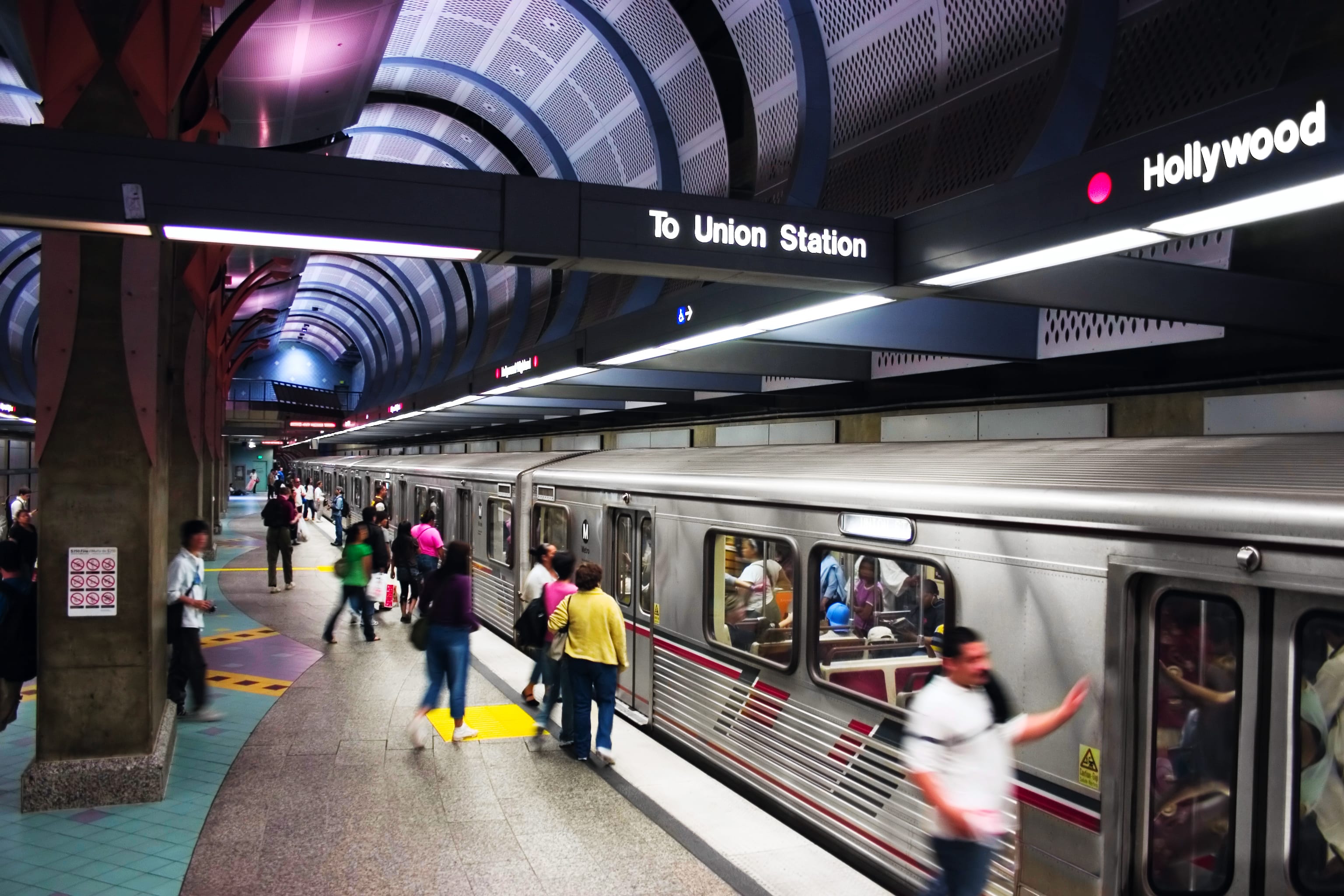 Image of Terminal, Railway, Train, Train Station, Vehicle, Adult, Male, Man, Person, Bag, Handbag, Female, Woman,