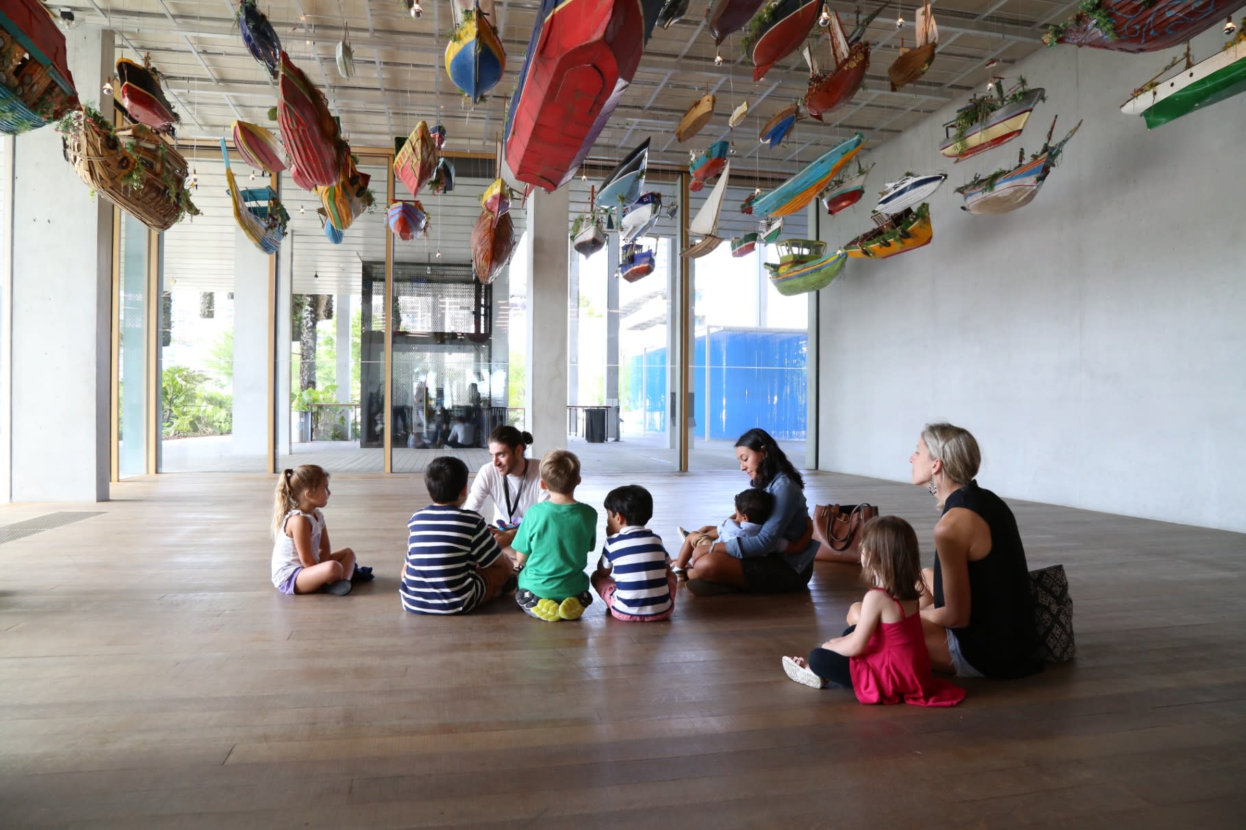 Image of Floor, Flooring, Adult, Female, Person, Woman, Handbag, Child, Girl, Plant, Boat, Shoe, 