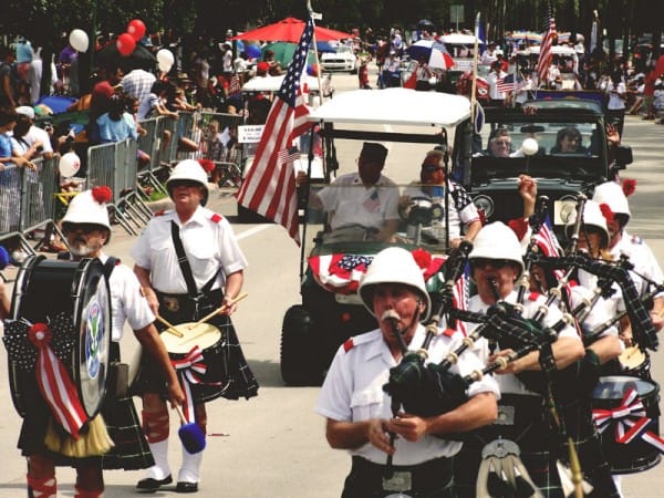 Image of People, Person, Helmet, Adult, Male, Man, Female, Woman, Flag, Hat, Balloon, Shoe, 