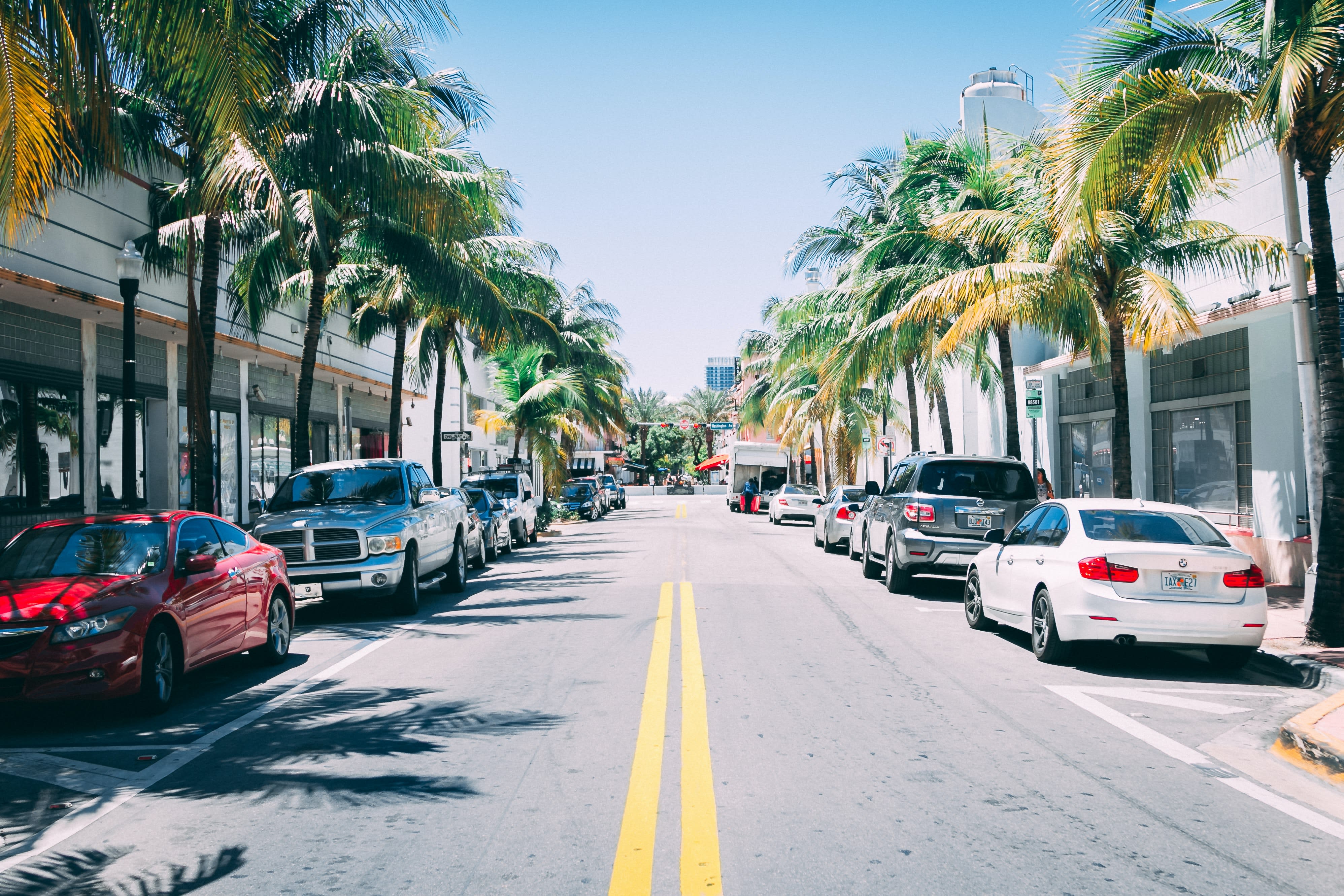 Image of City, Road, Street, Urban, Neighborhood, Cityscape, Car, Vehicle, Pickup Truck, Palm Tree, Tree, Person, Suburb, 