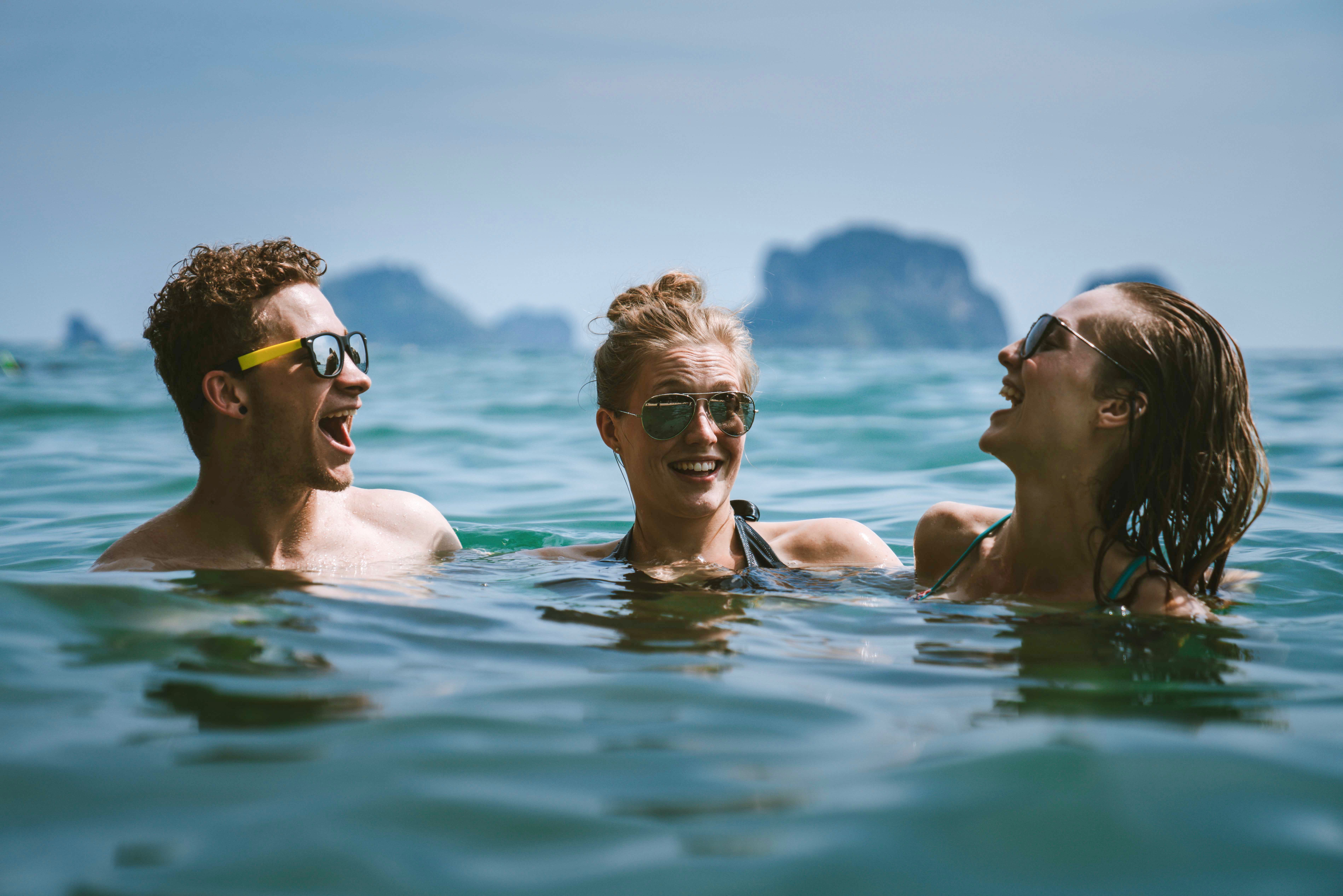 Image of Person, Swimming, Water, Water Sports, Head, Accessories, Glasses, Face, Happy, Adult, Female, Woman, Male, Man, Laughing, 