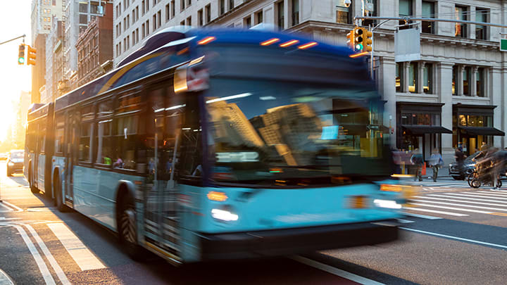 Image of Bus, Vehicle, Light, Traffic Light, Car, Person, 