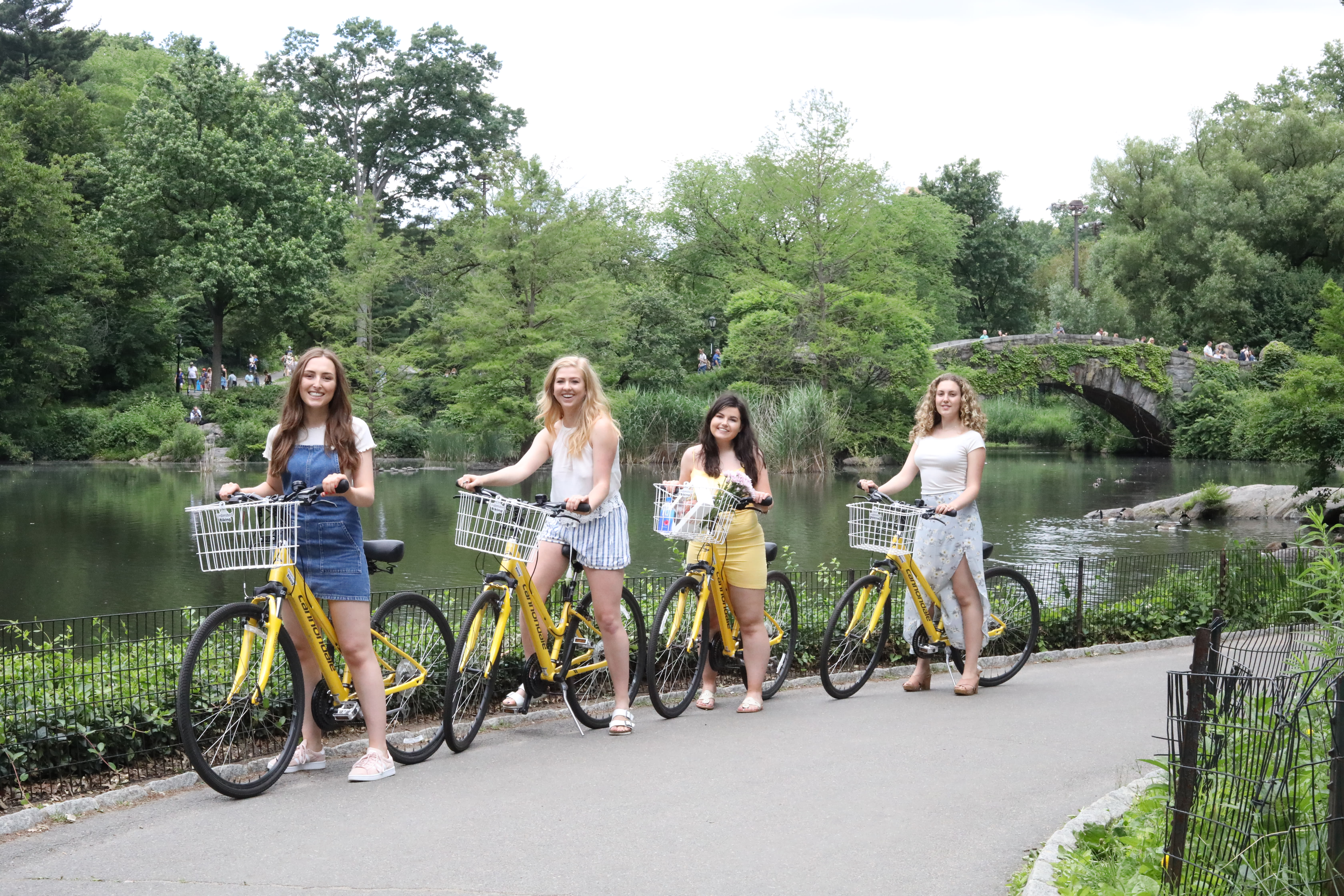 Image of Vegetation, Path, Grove, Land, Nature, Outdoors, Tree, Woodland, Canal, Water, Grass, Park, Female, Girl, Person, Teen, Summer, Bicycle, Vehicle, Towpath, People, Wheel, Shorts, 