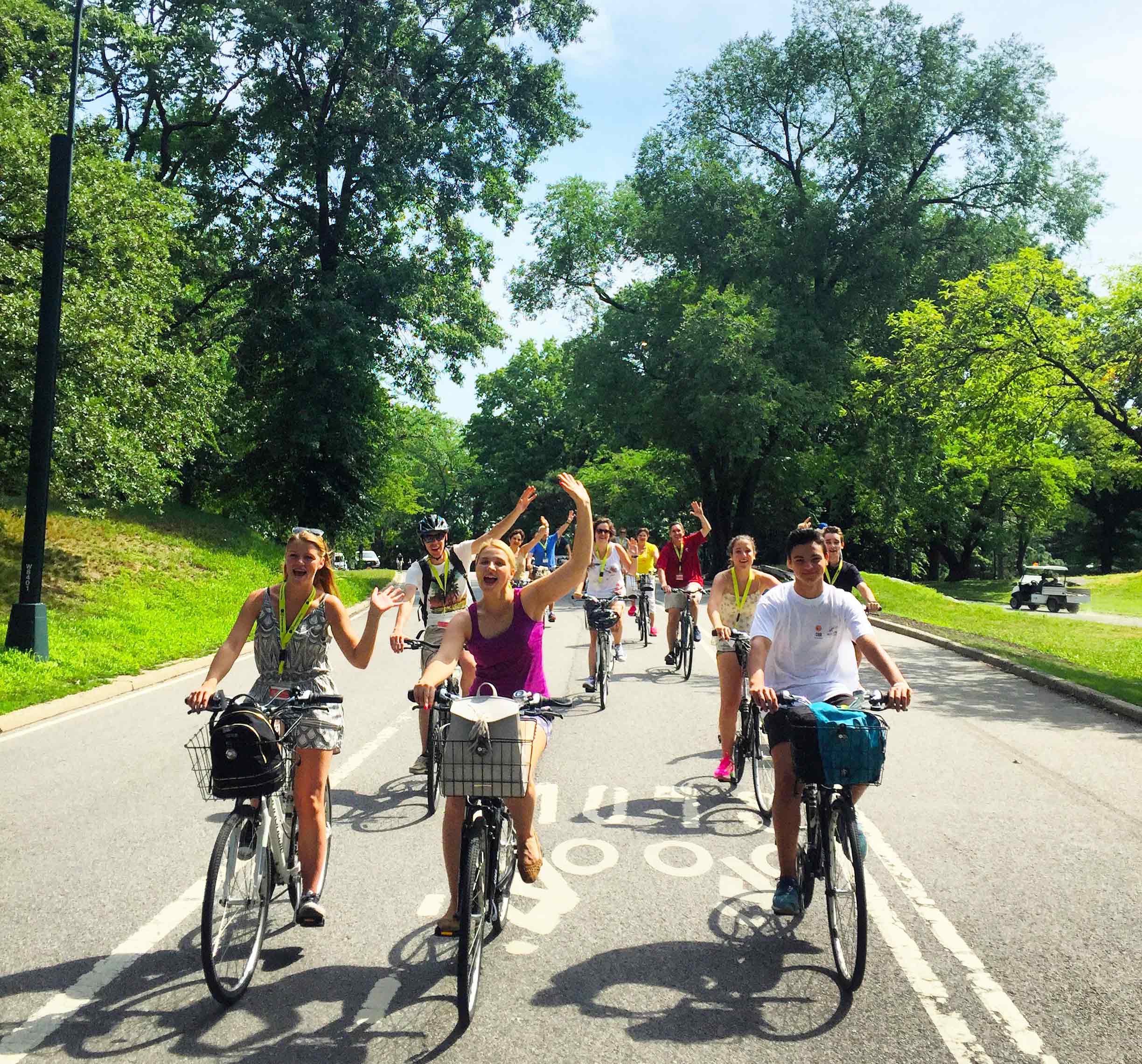 Image of People, Person, Helmet, Female, Girl, Teen, Boy, Male, Bicycle, Vehicle, Shoe, Handbag, Adult, Woman, Cycling, Vegetation, Car, Wheel, 