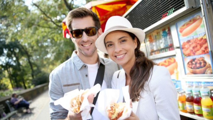 Image of Accessories, Sunglasses, Food, Lunch, Hat, Hot Dog, Adult, Male, Man, Person, Face, Head, Photography, Portrait, People, Female, Woman, Baseball Cap, Cap, 