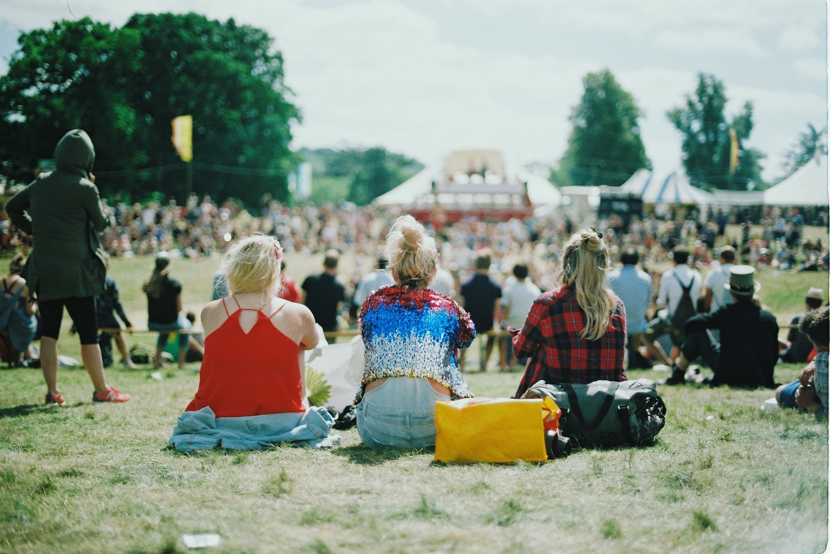 Image of Grass, Shoe, Nature, Outdoors, Park, Concert, Crowd, Person, Bag, Handbag, Backpack, Adult, Male, Man, Female, Woman, Child, Girl, People, Hat, Pants, 