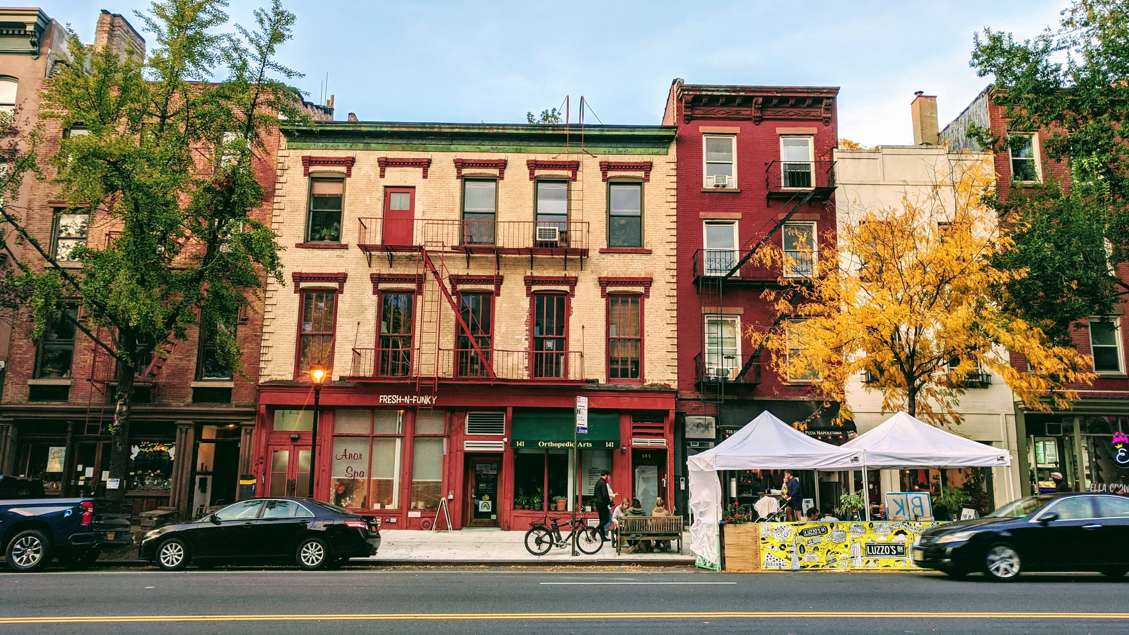 Image of City, Neighborhood, Urban, Road, Street, Apartment Building, High Rise, Car, Vehicle, Pickup Truck, Bench, Person, Bicycle, Housing, Condo, House, 