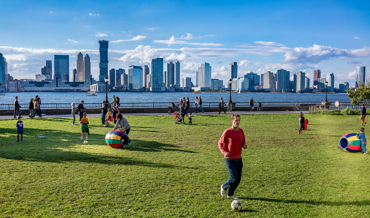 Image of City, Person, Cityscape, Urban, Grass, Nature, Outdoors, Park, Football, Soccer, Soccer Ball, People, 