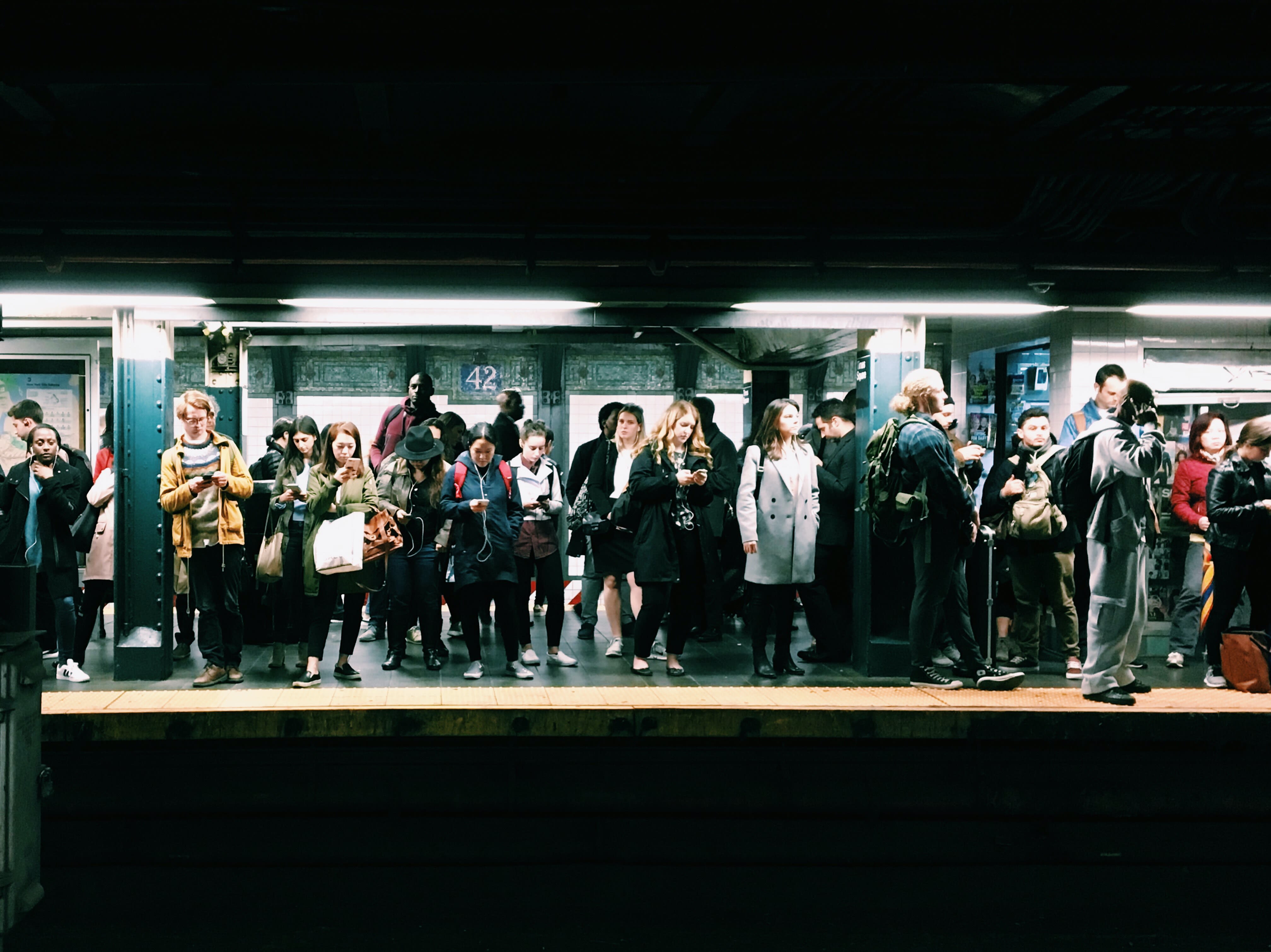 Image of Bag, Handbag, People, Person, Lighting, Coat, Adult, Male, Man, Terminal, Railway, Train, Train Station, Vehicle, 