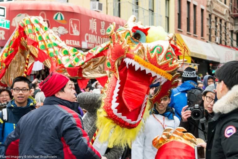 Image of Camera, Glasses, Chinese New Year, Festival, Adult, Male, Man, Person, Hat, Female, Woman, 