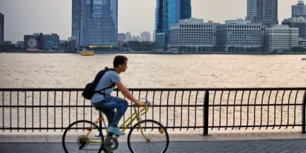 Image of Shoe, Bicycle, Cycling, Person, Vehicle, Adult, Male, Man, Backpack, Bag, Handbag, City, Cityscape, Urban, 