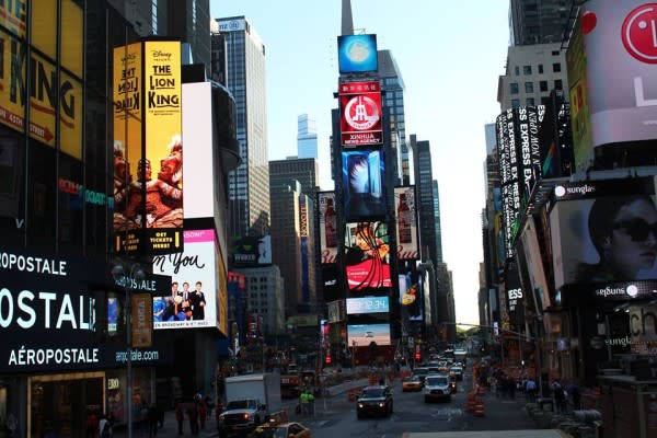 Image of City, Metropolis, Urban, Road, Street, Truck, Vehicle, Advertisement, Car, Adult, Male, Man, Person, Neighborhood, Glasses, Cityscape, High Rise, Shop, Shopping Mall, 