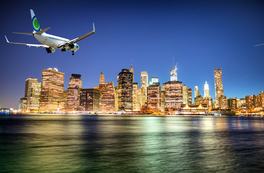 Image of City, Metropolis, Urban, Cityscape, Aircraft, Airplane, Vehicle, Flight, Airliner, Nature, Outdoors, Scenery, 