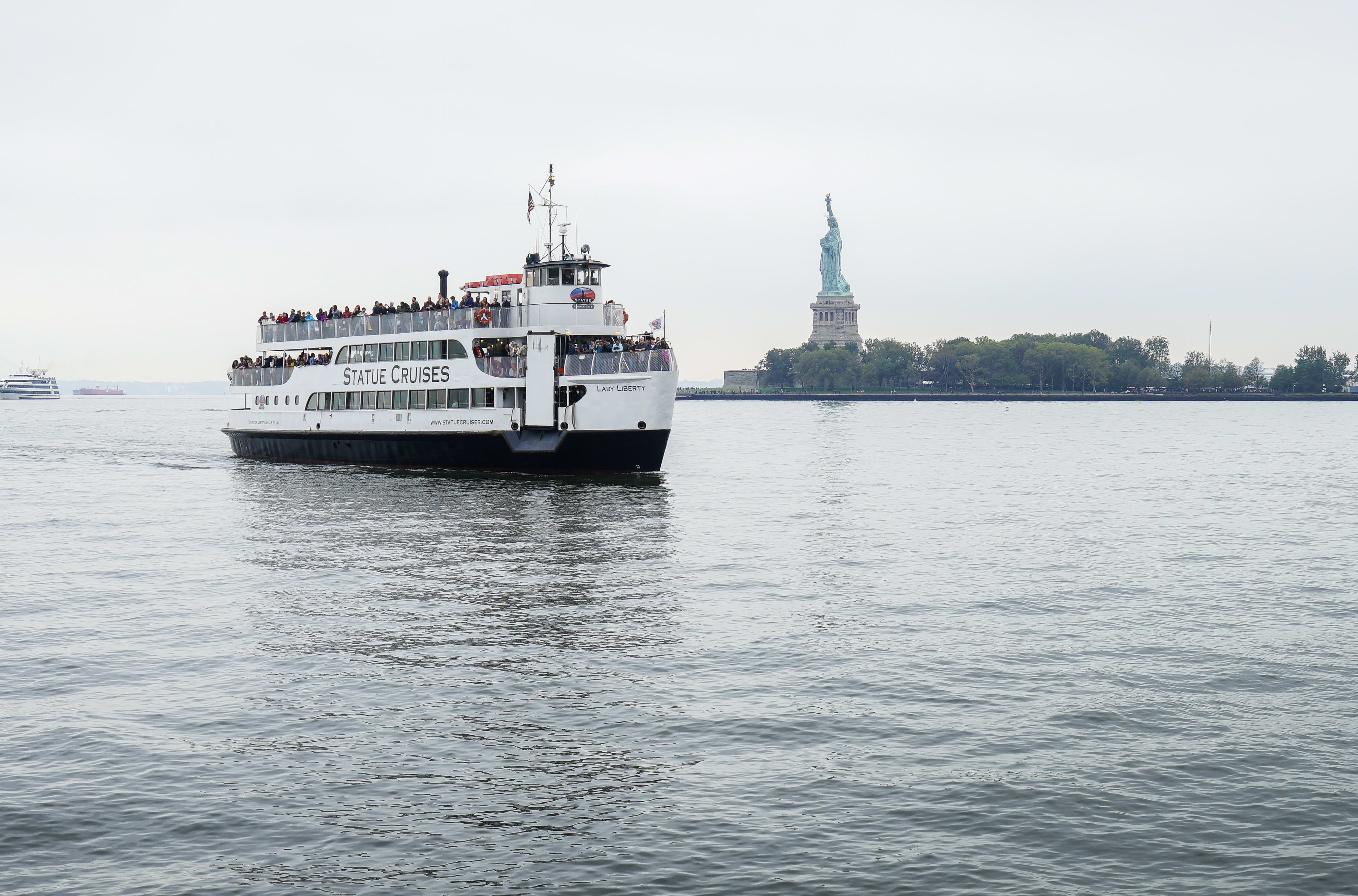 Image of Boat, Ferry, Vehicle, Water, Waterfront, Person, 