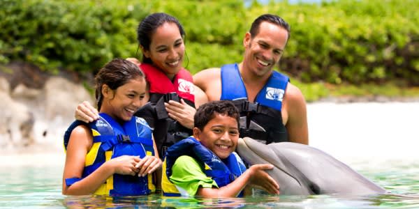 Image of Lifejacket, Vest, People, Person, Child, Female, Girl, Boy, Male, Animal, Dolphin, Mammal, Sea Life, Adult, Man, 