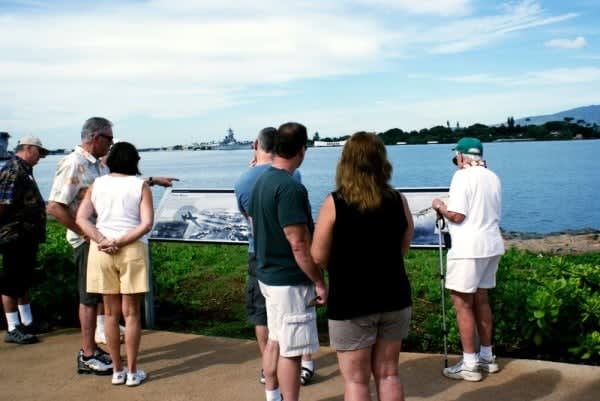 Image of Shorts, T-Shirt, Water, Waterfront, Nature, Outdoors, Scenery, Adult, Female, Person, Woman, Male, Man, Shoe, Hat, Glasses, 