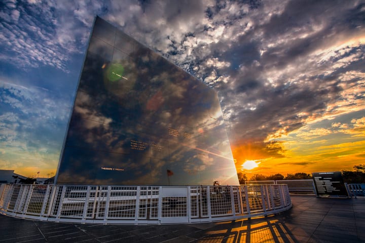 Image of Sunlight, Nature, Outdoors, Sky, City, Office Building, Urban, Railing, Handrail, Sunset, Water, Waterfront, Cloud, Flare, Light, 