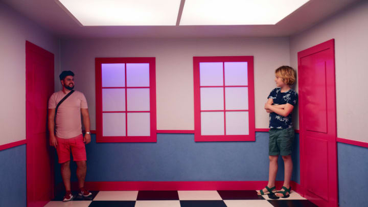 Image of Shorts, Pants, Floor, Flooring, T-Shirt, Indoors, Interior Design, Purple, Adult, Male, Man, Person, Shoe, Boy, Child, Face, Head, Photography, Portrait, 