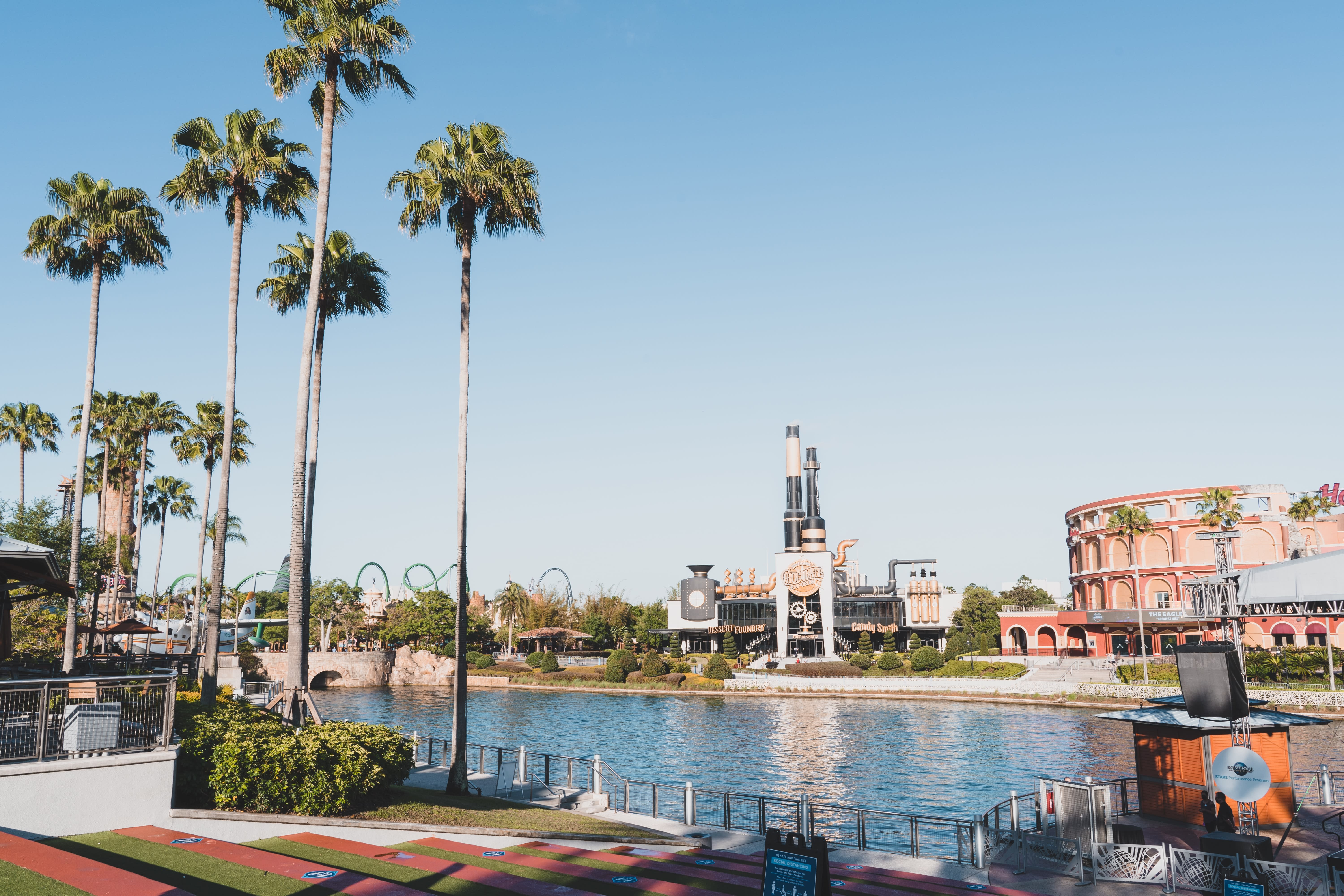 Image of Nature, Outdoors, Scenery, City, Urban, Building, Cityscape, Tree, Water, Waterfront, Palm Tree, Person, Summer, 